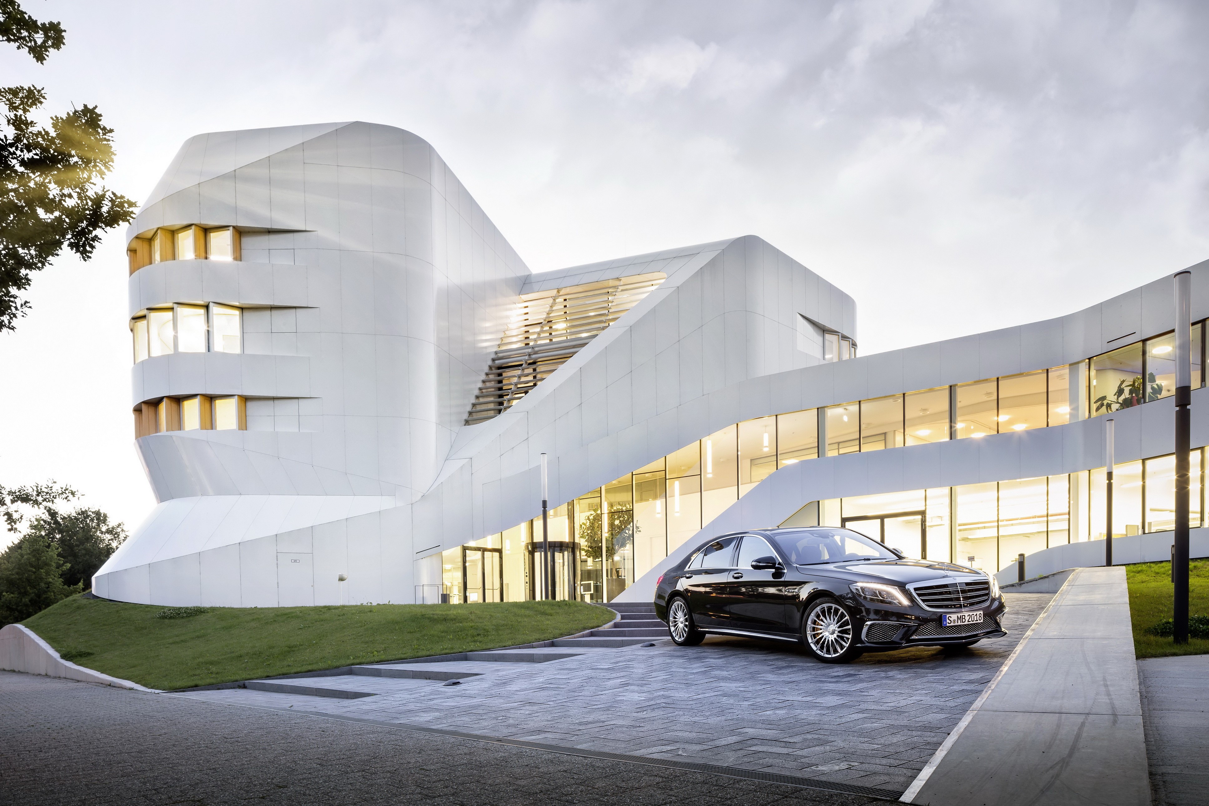 2013 S65 W222 AMG Mercedes-Benz in front of modern building HD Wallpaper