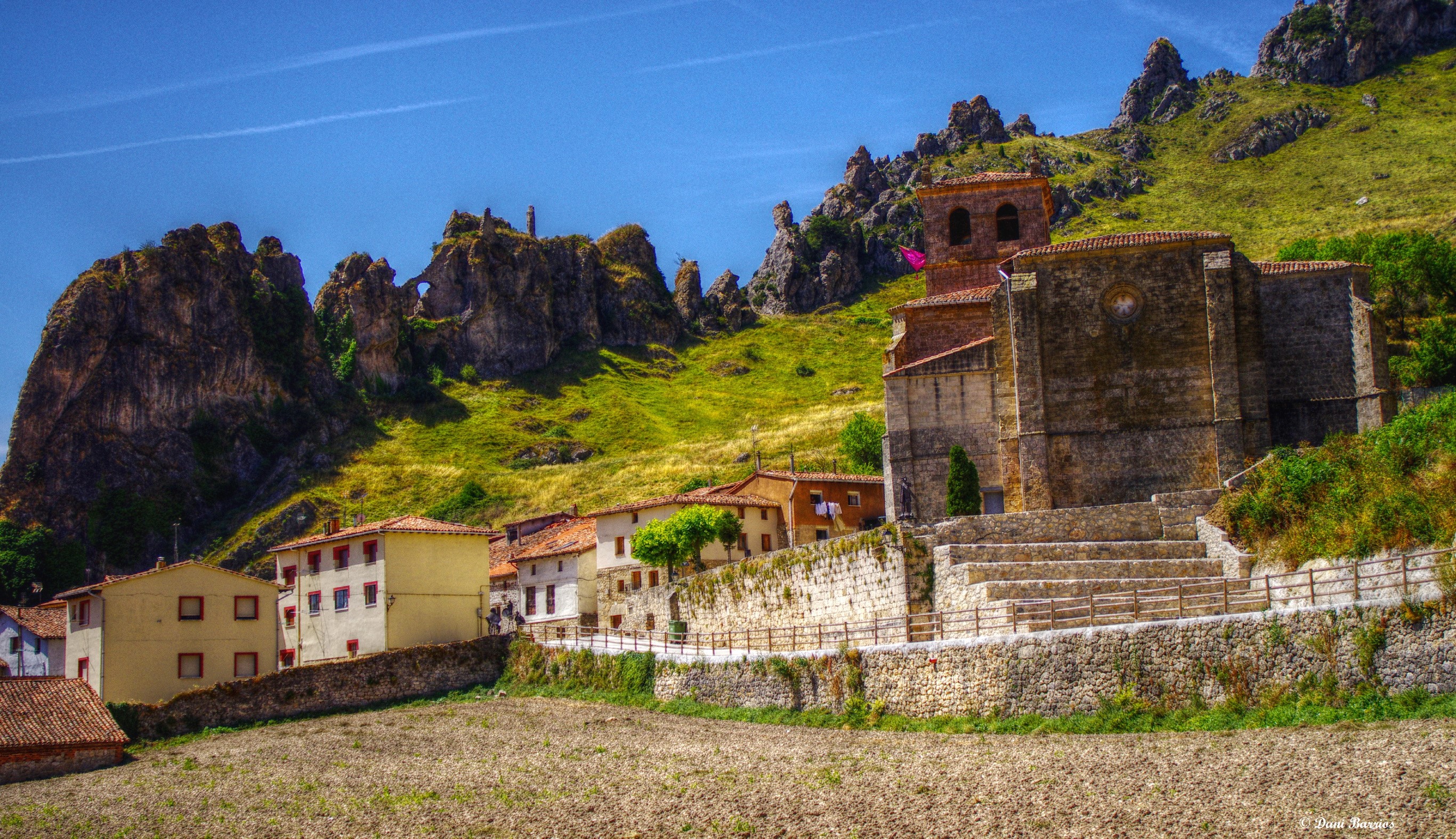 Pancorbo, Spain village with church and rocky mountains HD Wallpaper