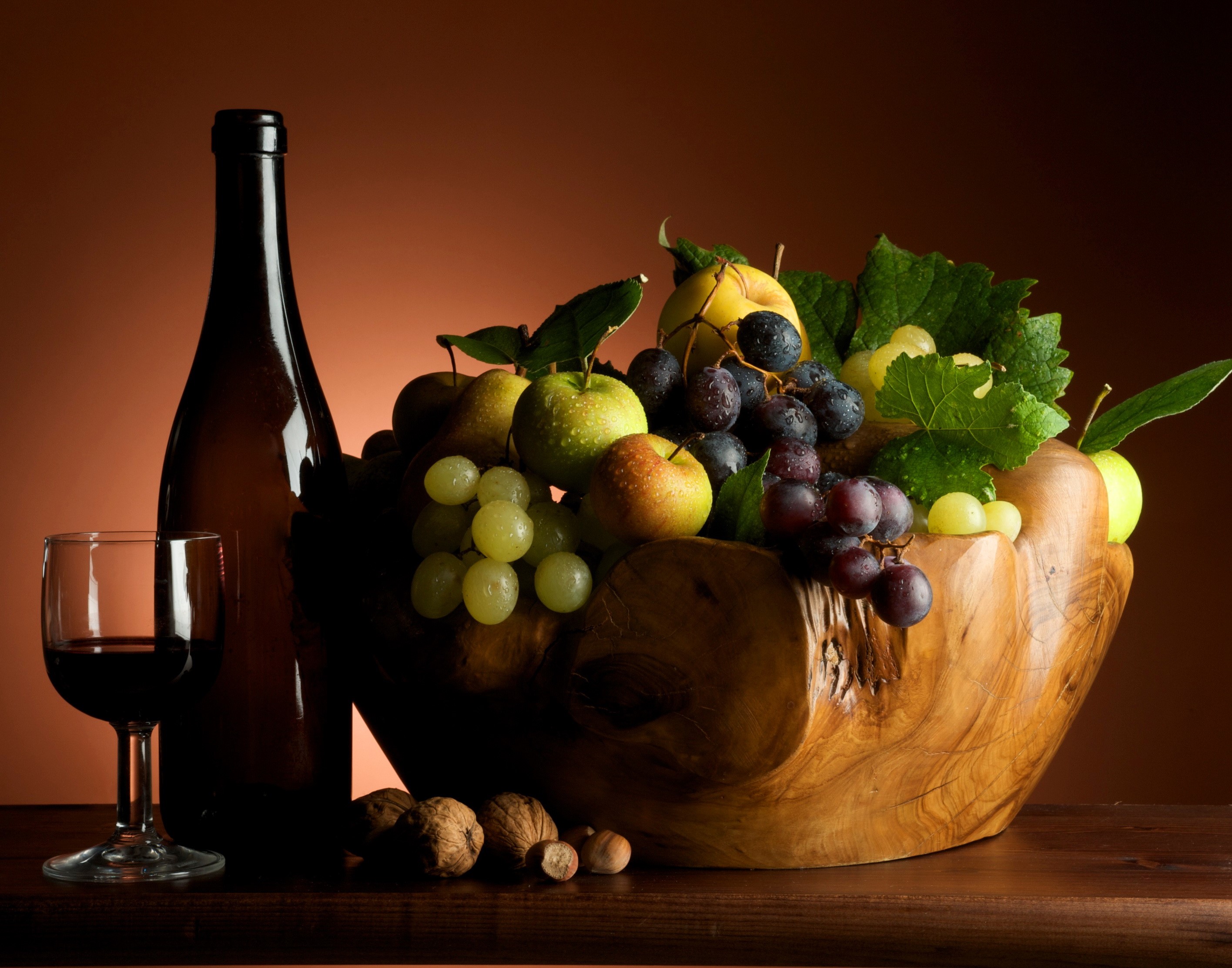 Still life with wine bottle, glass, fruit bowl, and nuts HD Wallpaper