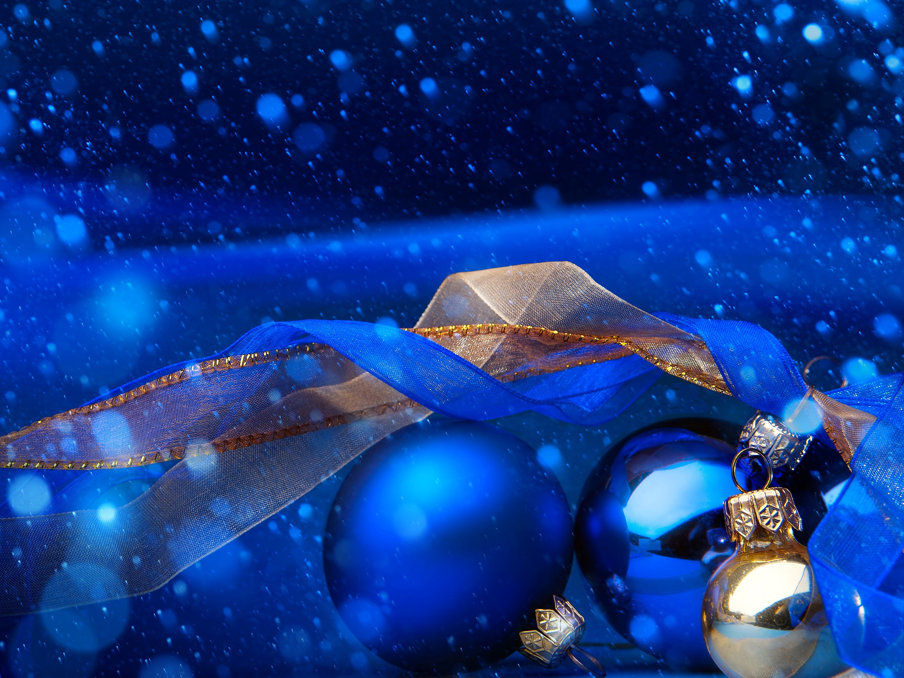 Christmas ornaments and ribbon with falling snow HD Wallpaper