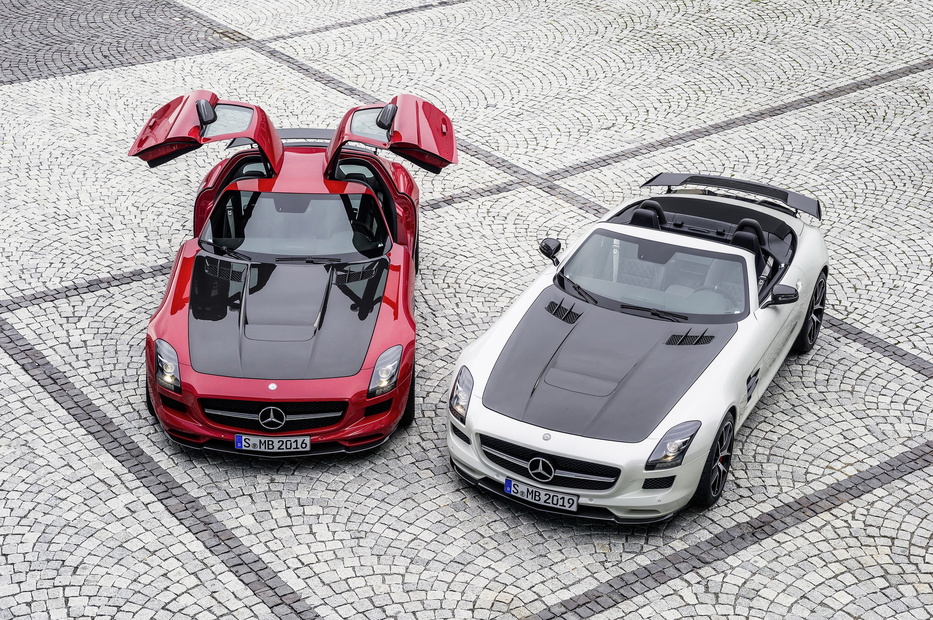 Two Mercedes-Benz SLS AMG GT Roadsters on Cobblestone HD Wallpaper