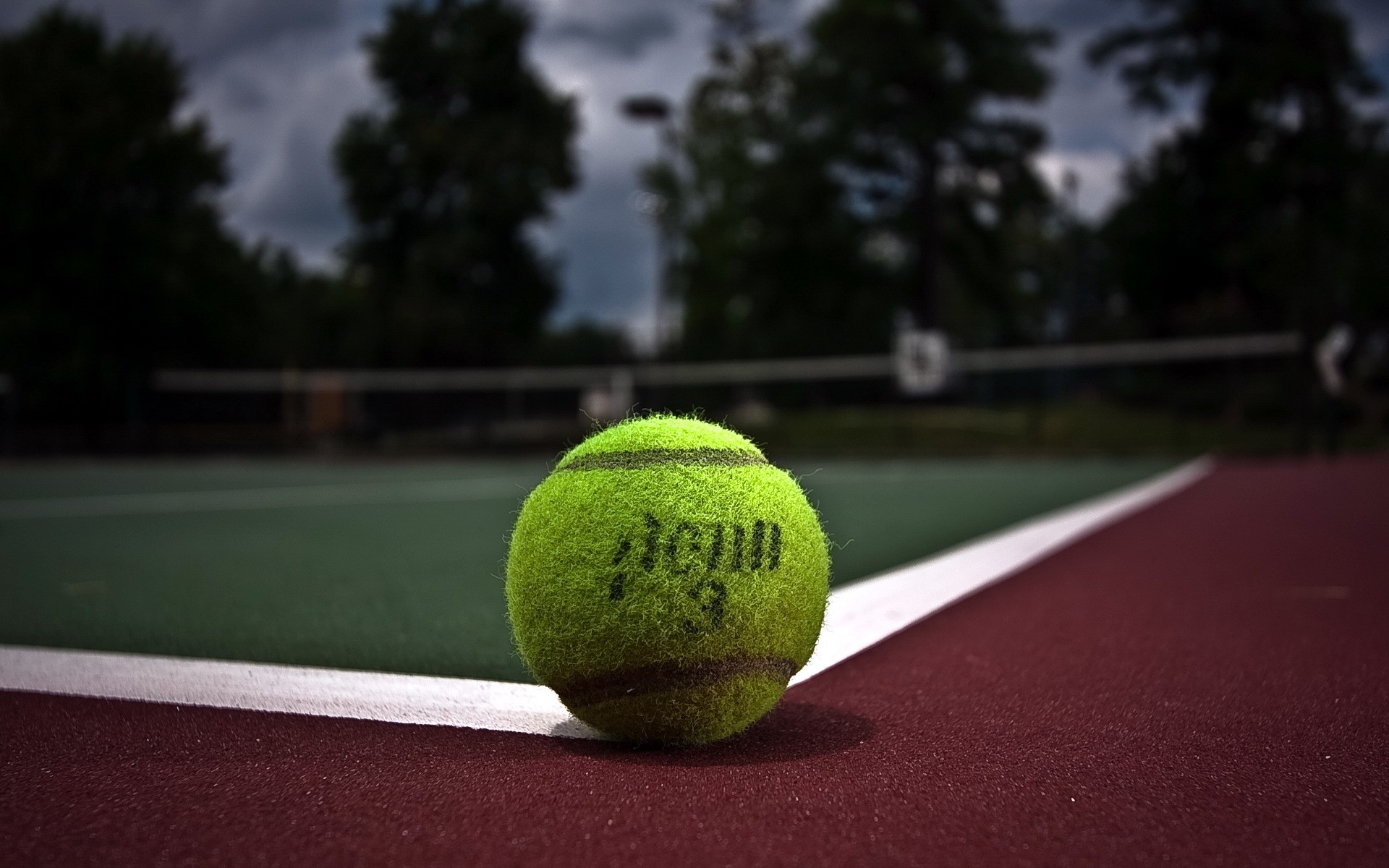 Tennis ball on a tennis court HD Wallpaper