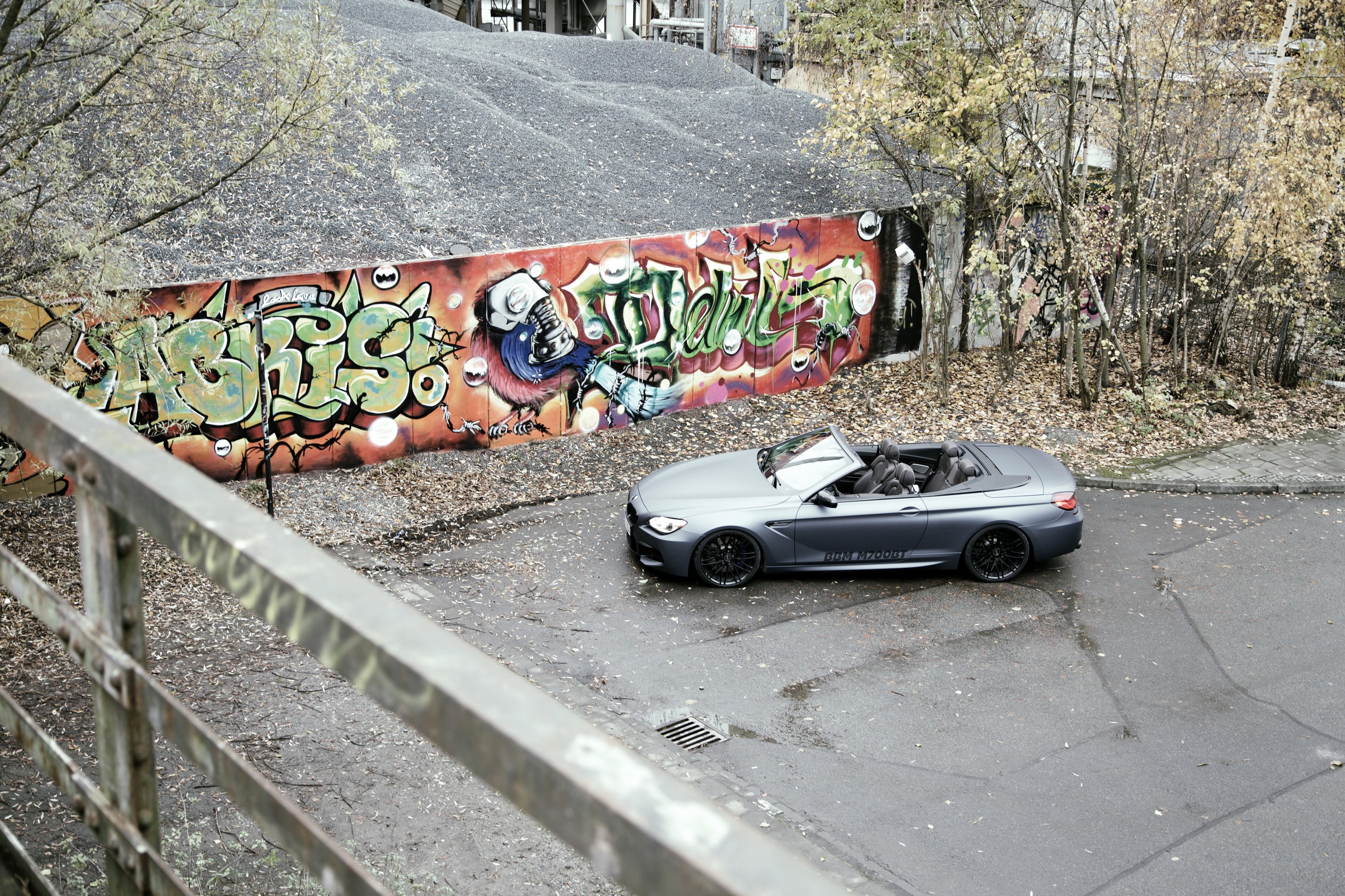 BMW M6 Cabriolet parked near graffiti wall HD Wallpaper