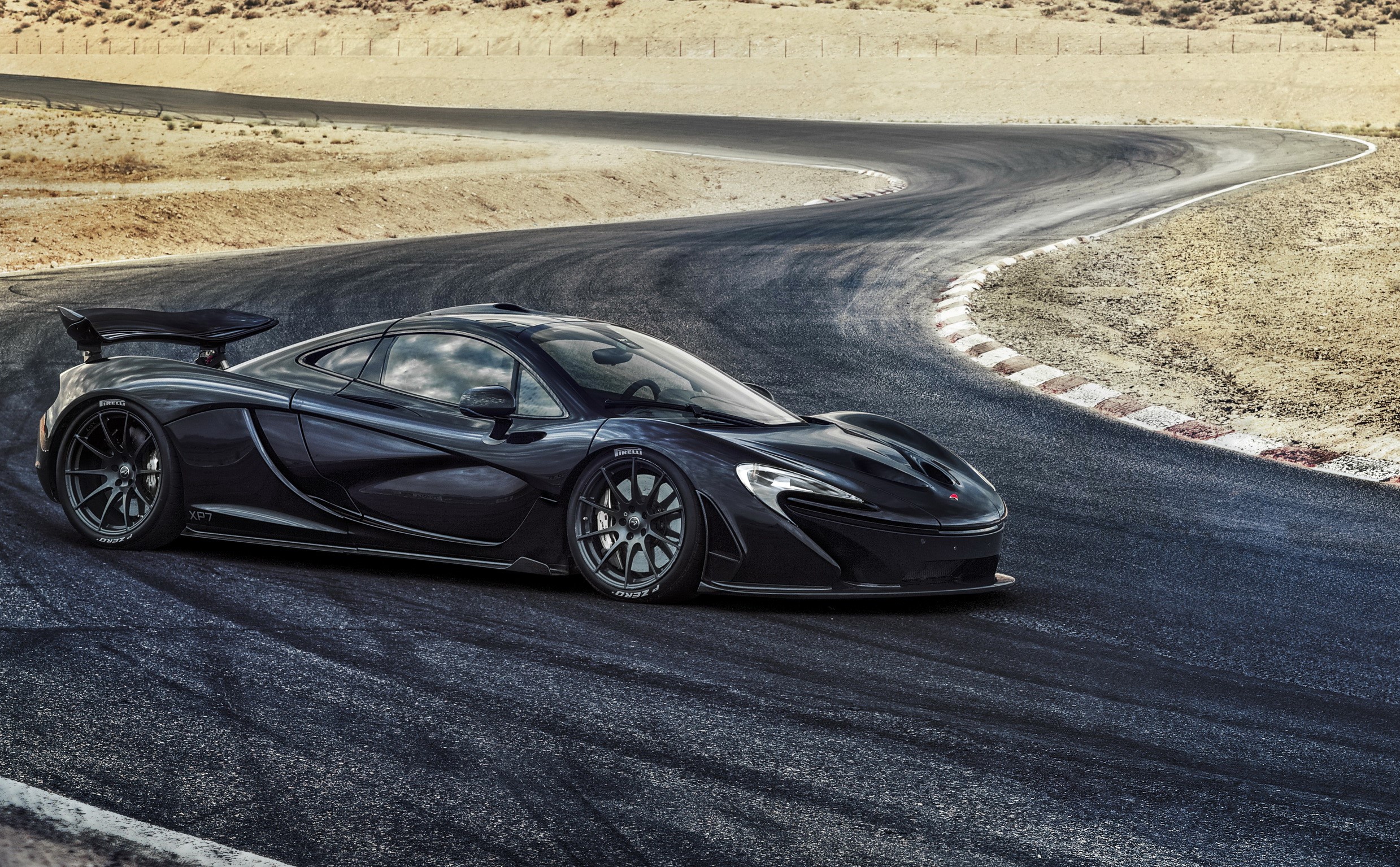 Black McLaren P1 on a Race Track HD Wallpaper