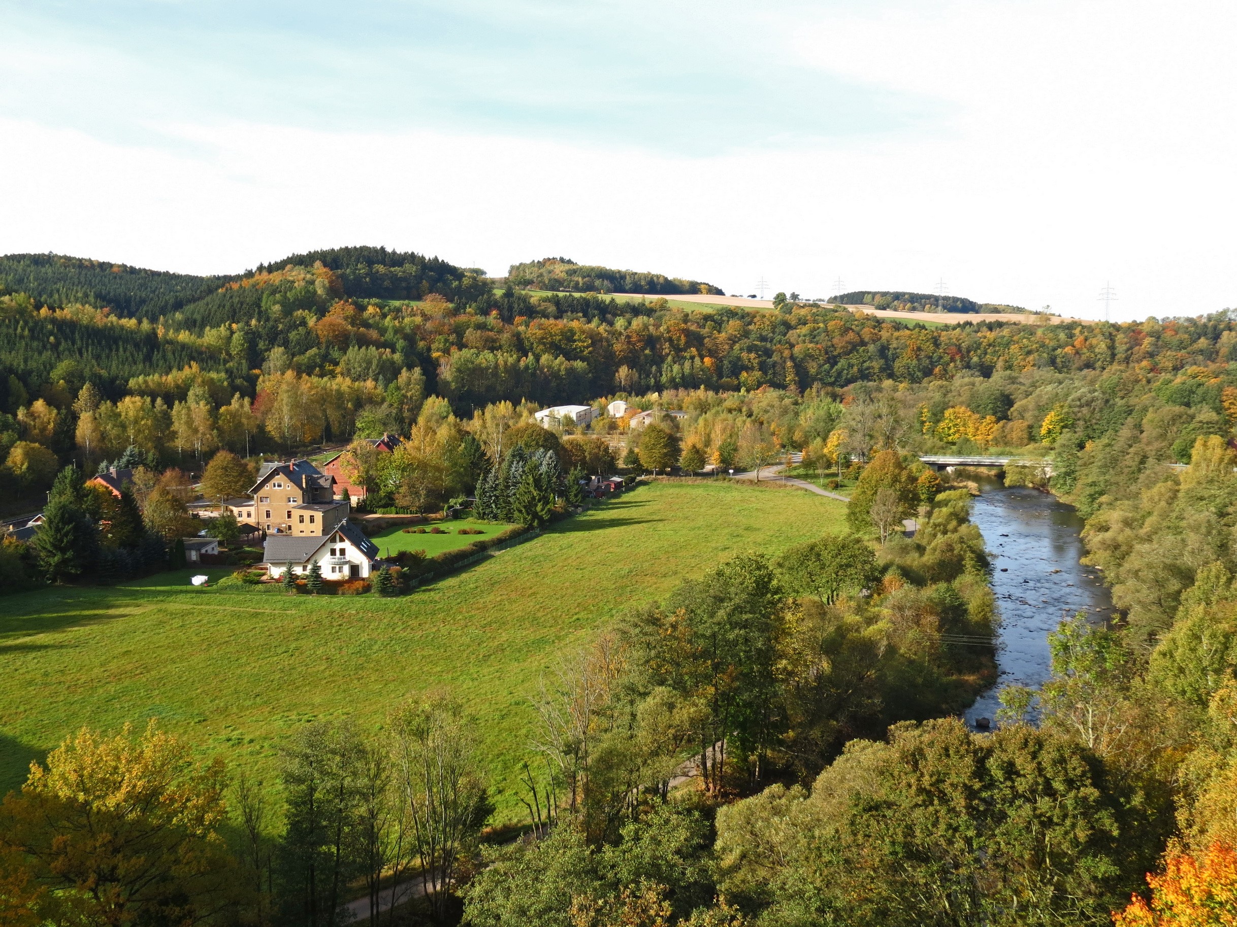 Autumn landscape with river and village in Oederan, Germany HD Wallpaper