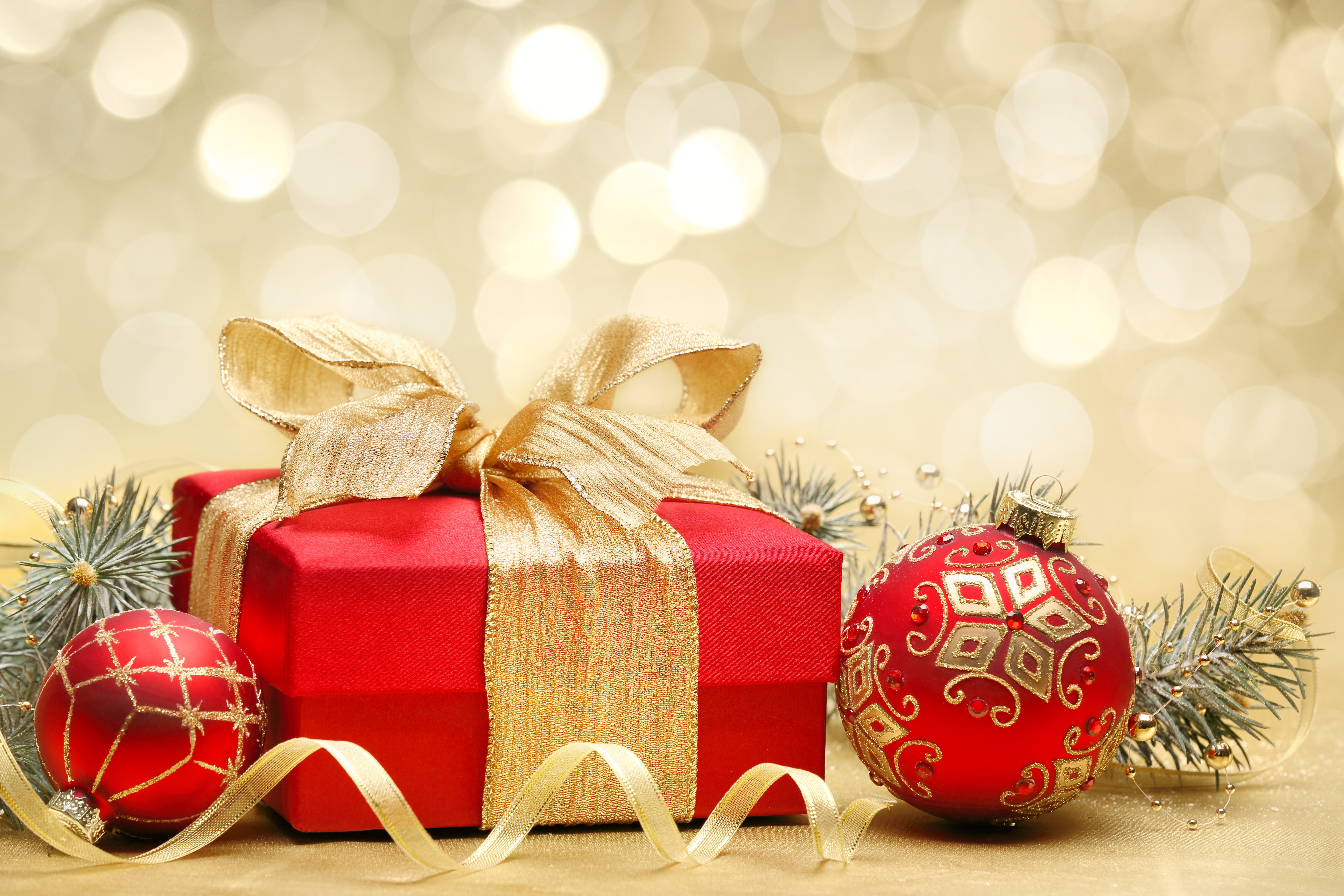 Christmas gift box with ornaments and pine branches HD Wallpaper