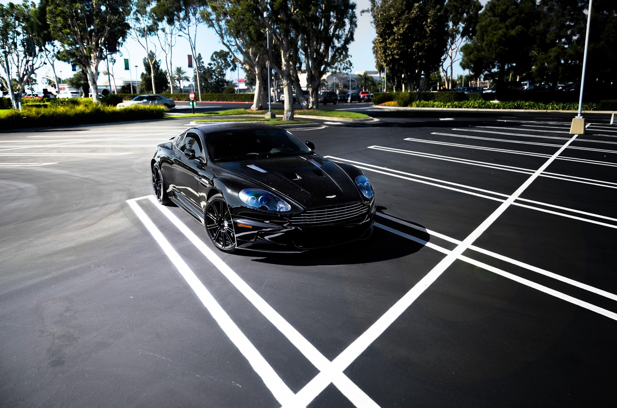 Black Aston Martin DBS parked in a parking lot HD Wallpaper
