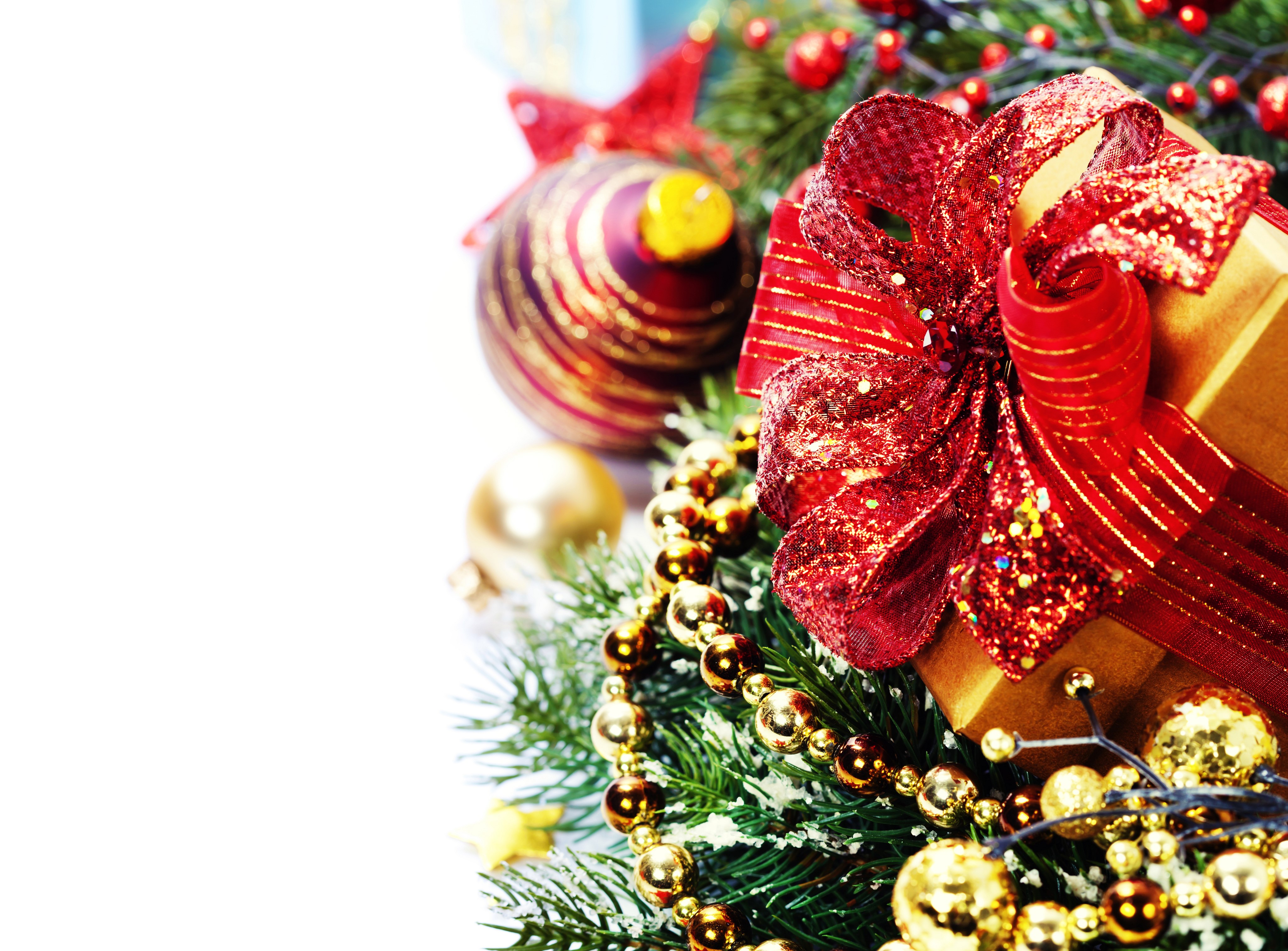 Christmas gift with red bow and ornaments HD Wallpaper