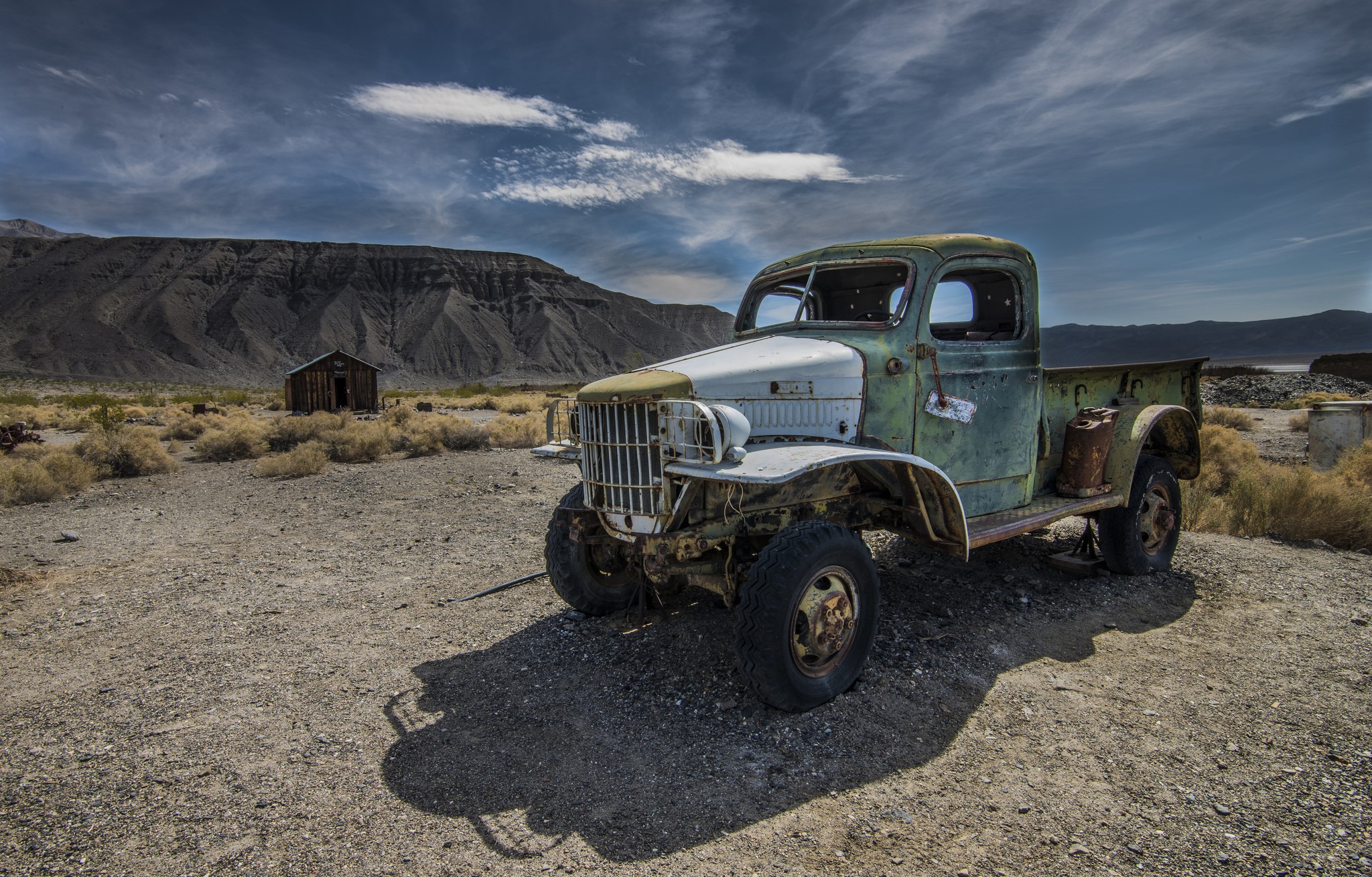 Old abandoned truck in a desert landscape HD Wallpaper