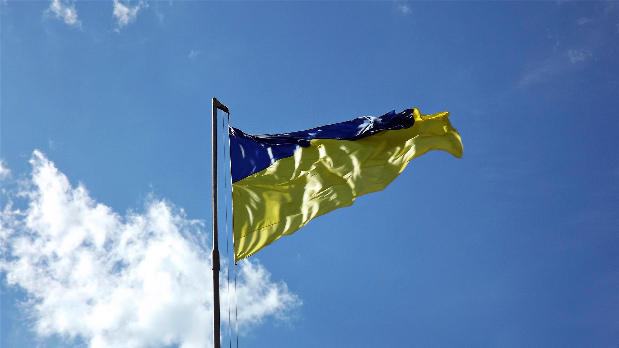 Ukraine flag waving in the blue sky HD Wallpaper