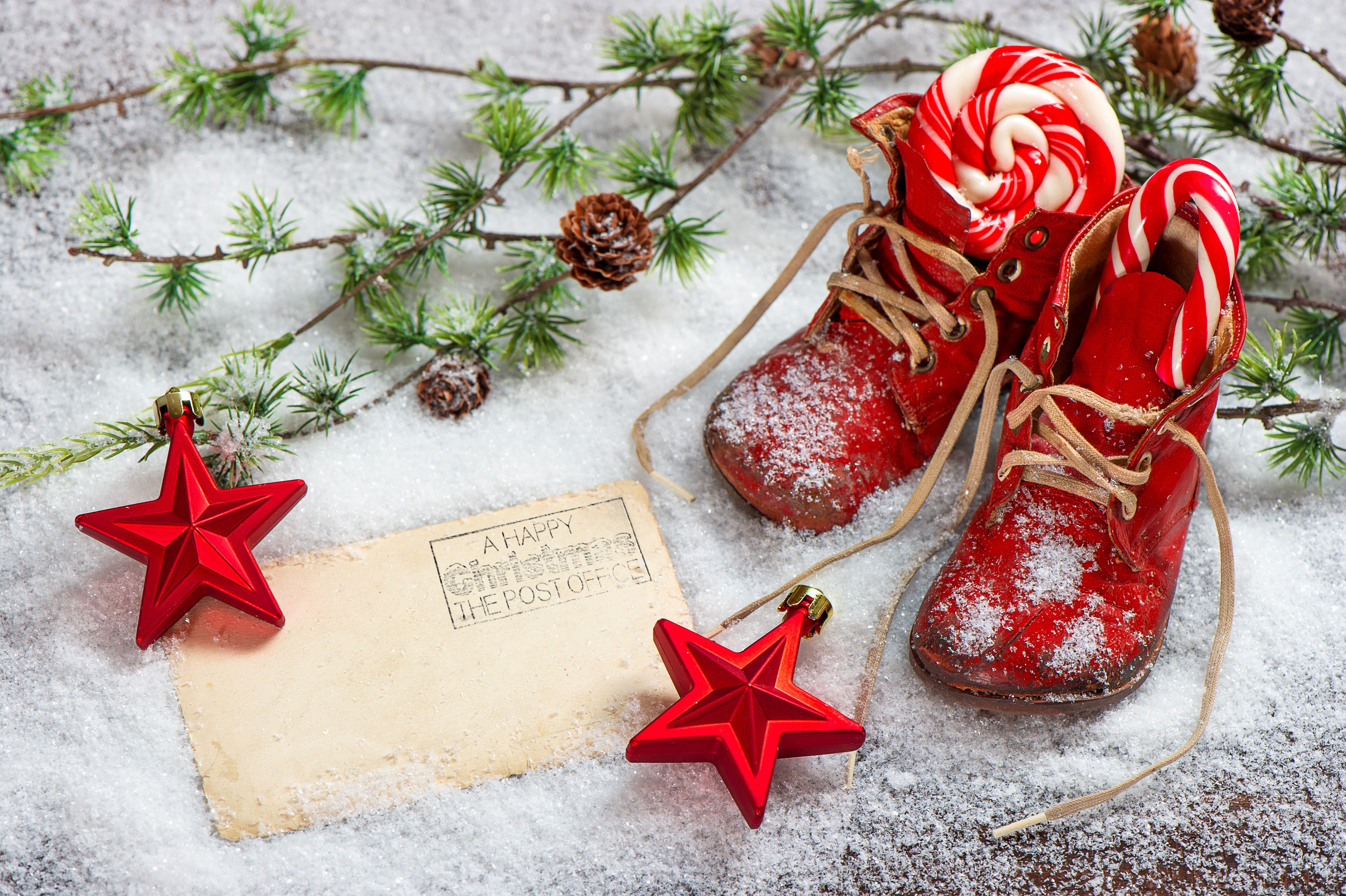 Christmas boots with candy canes and stars in snow HD Wallpaper
