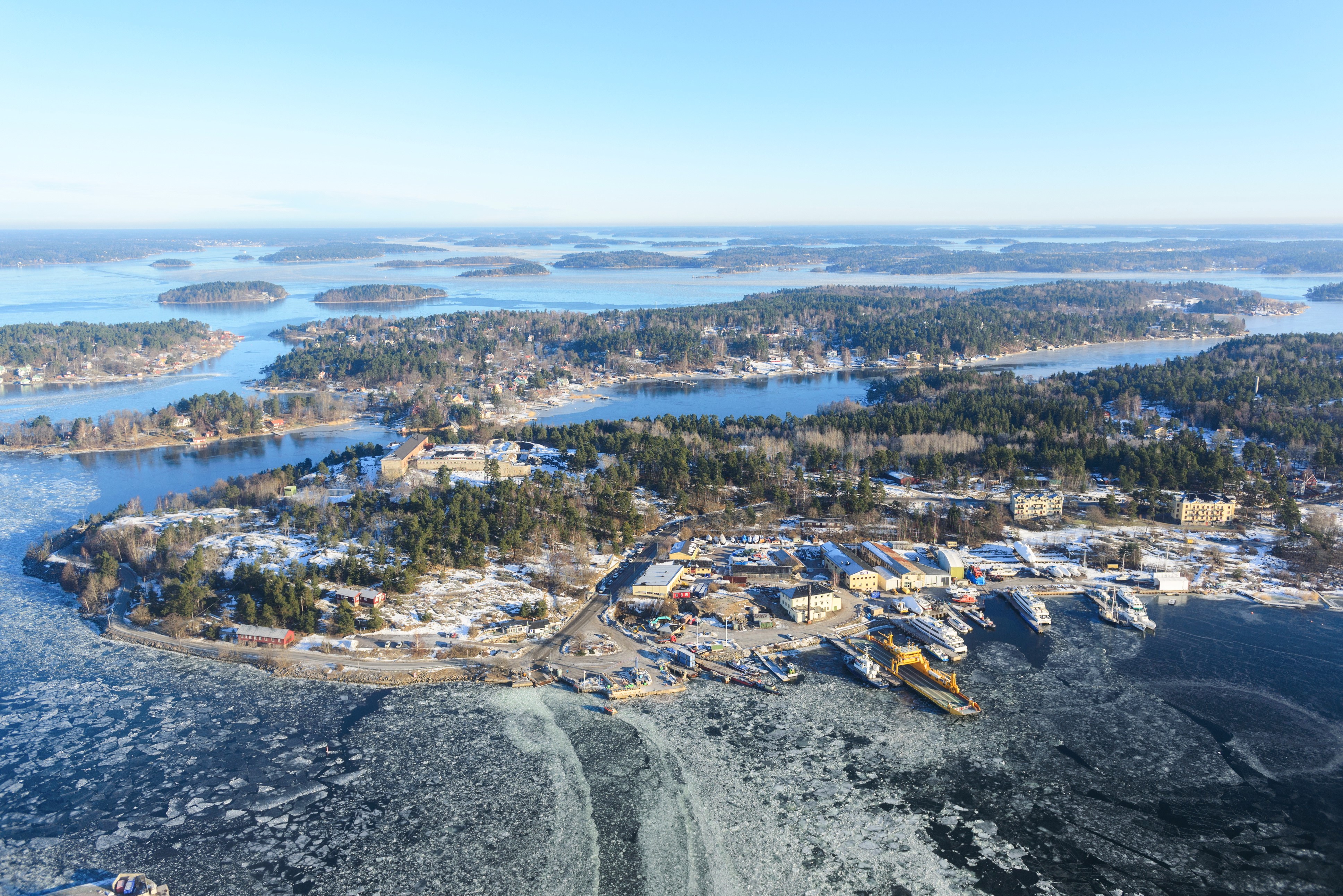 Aerial view of Swedish islands in winter with frozen water HD Wallpaper