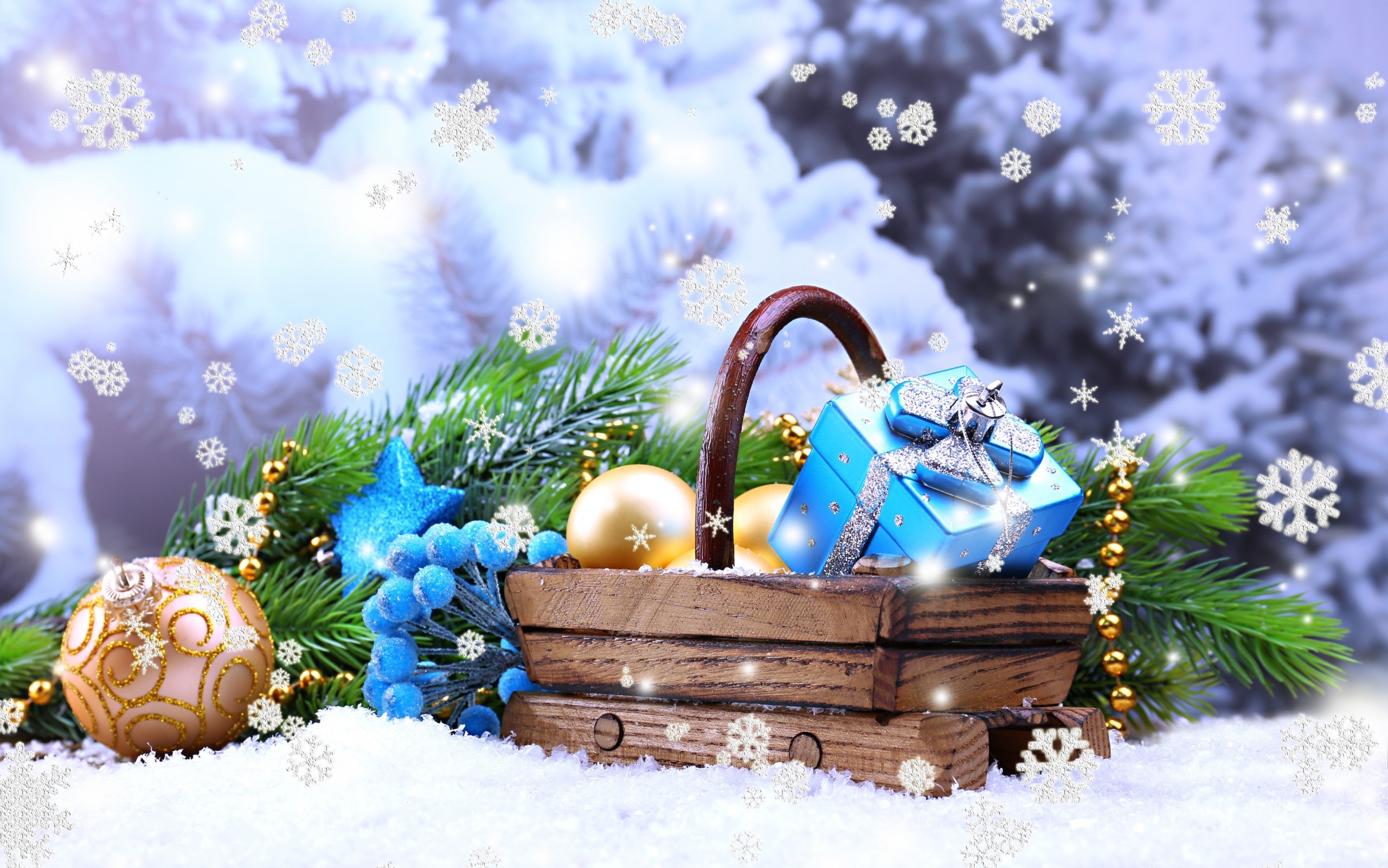 Christmas basket with gifts and ornaments in snow HD Wallpaper