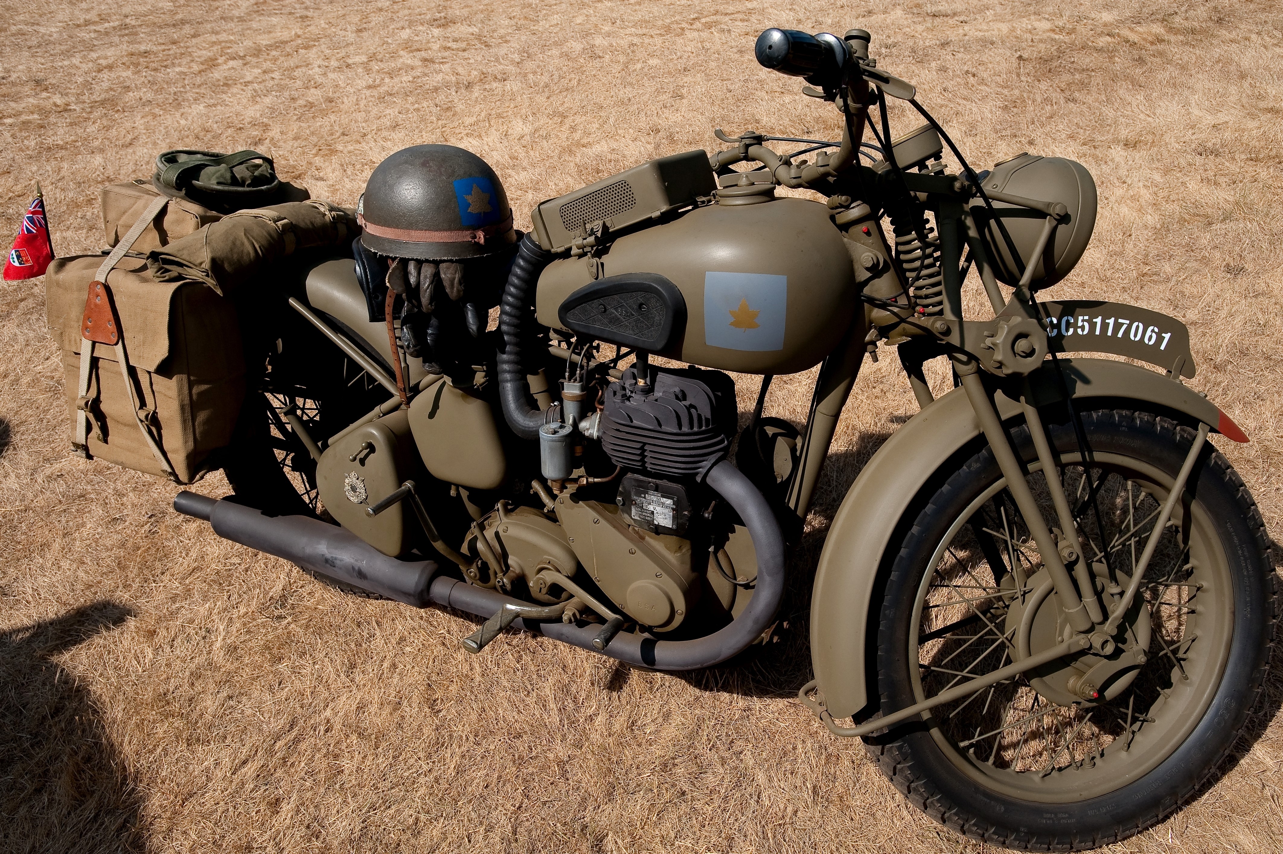 BSA M20 military motorcycle with helmet and bags HD Wallpaper