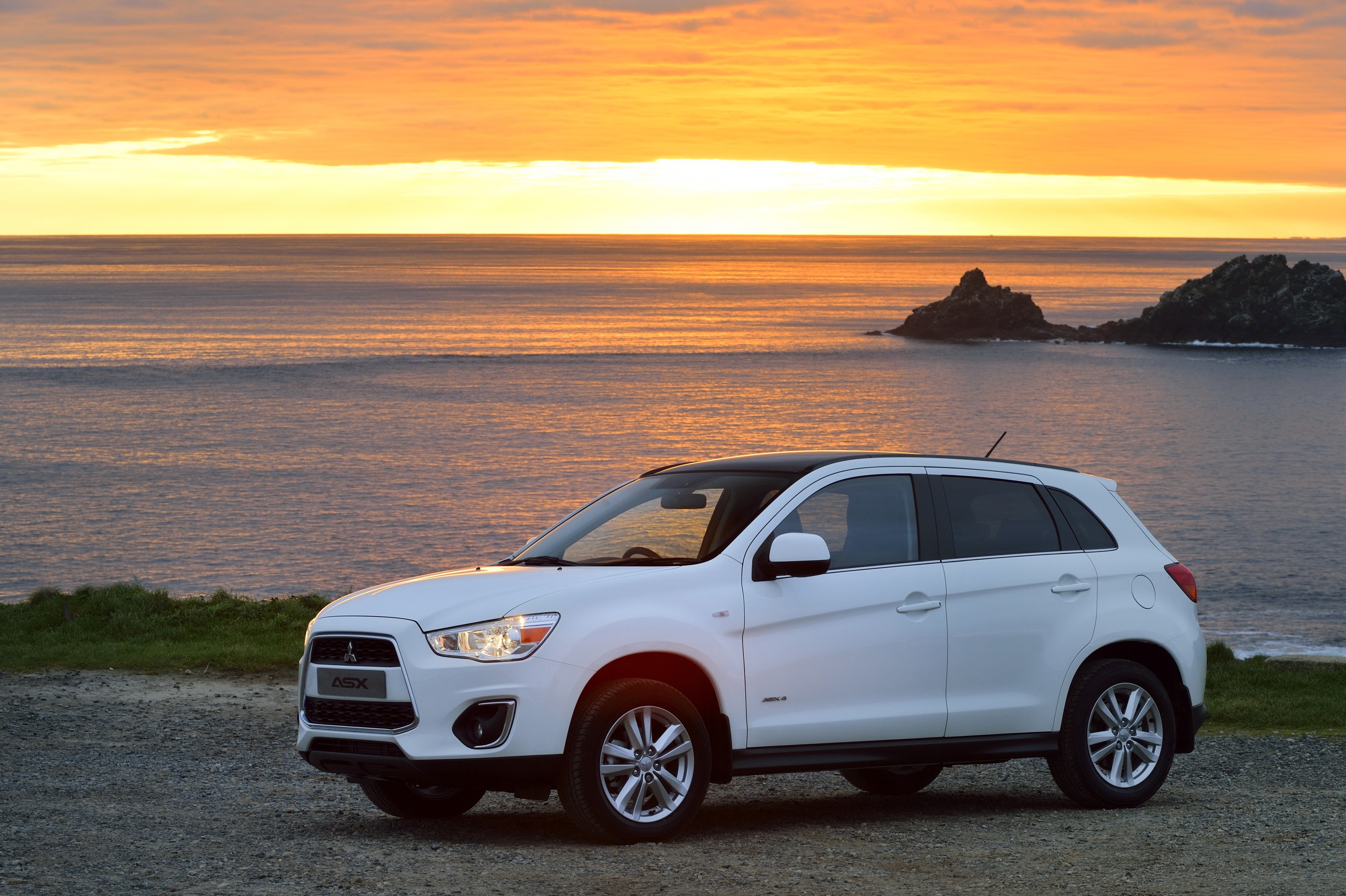 White Mitsubishi ASX parked by the sea at sunset HD Wallpaper