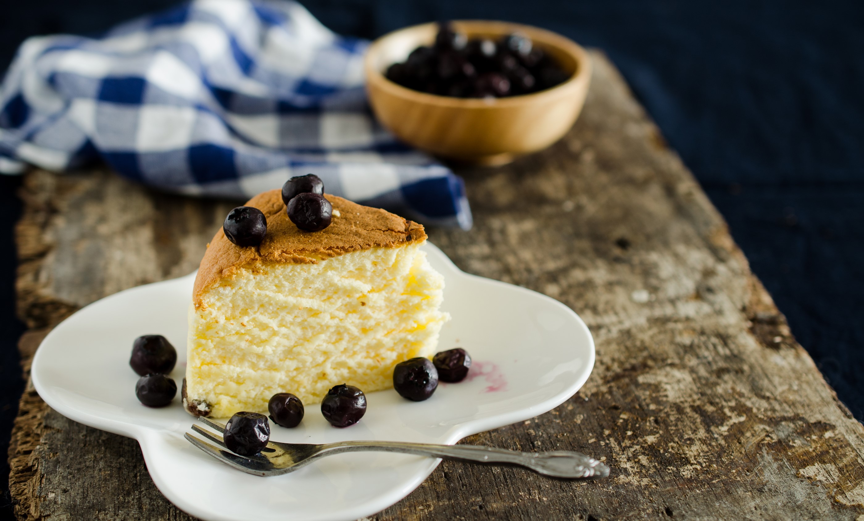 Slice of cheesecake with blueberries on a plate HD Wallpaper