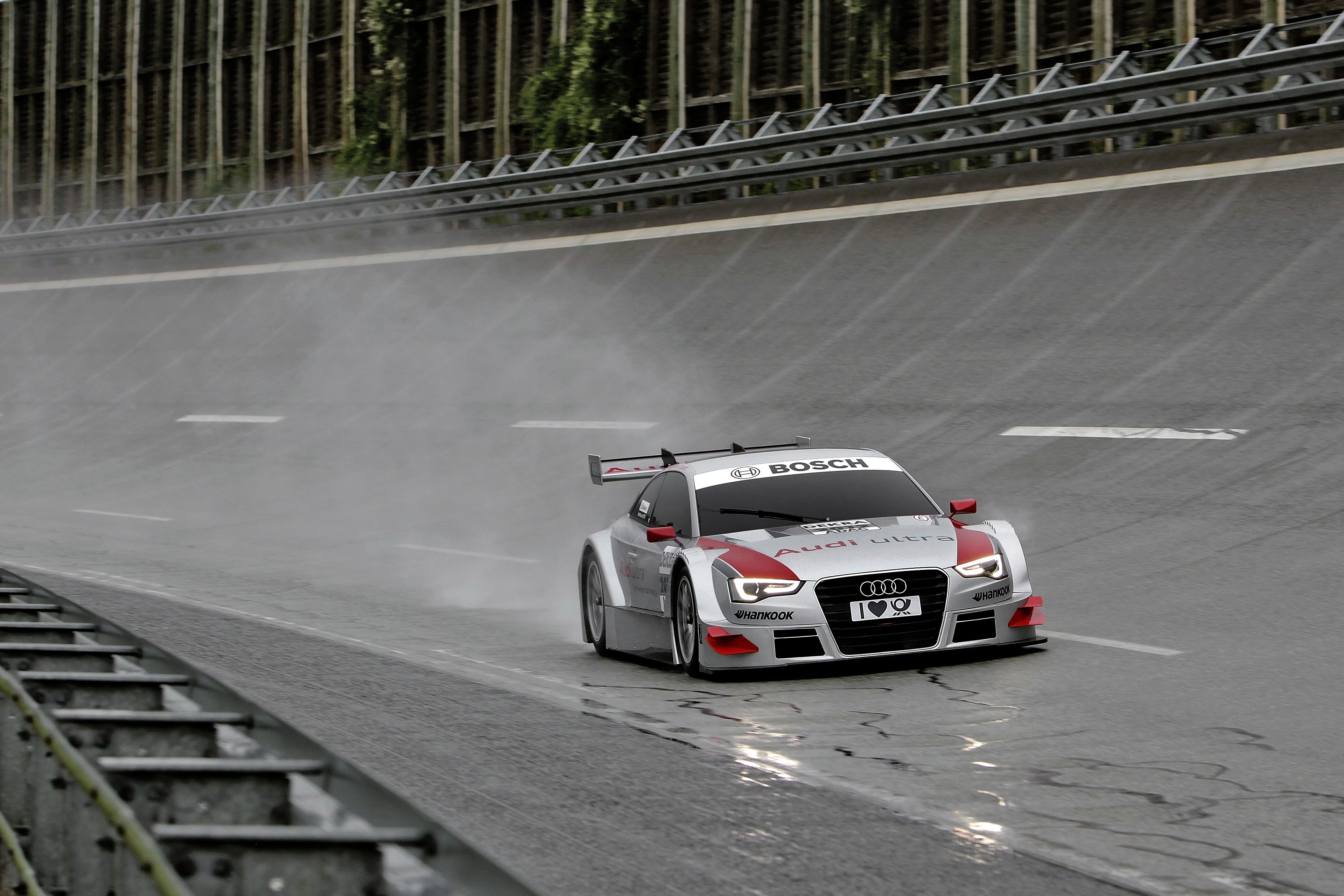 Audi A5 DTM car on a wet race track HD Wallpaper