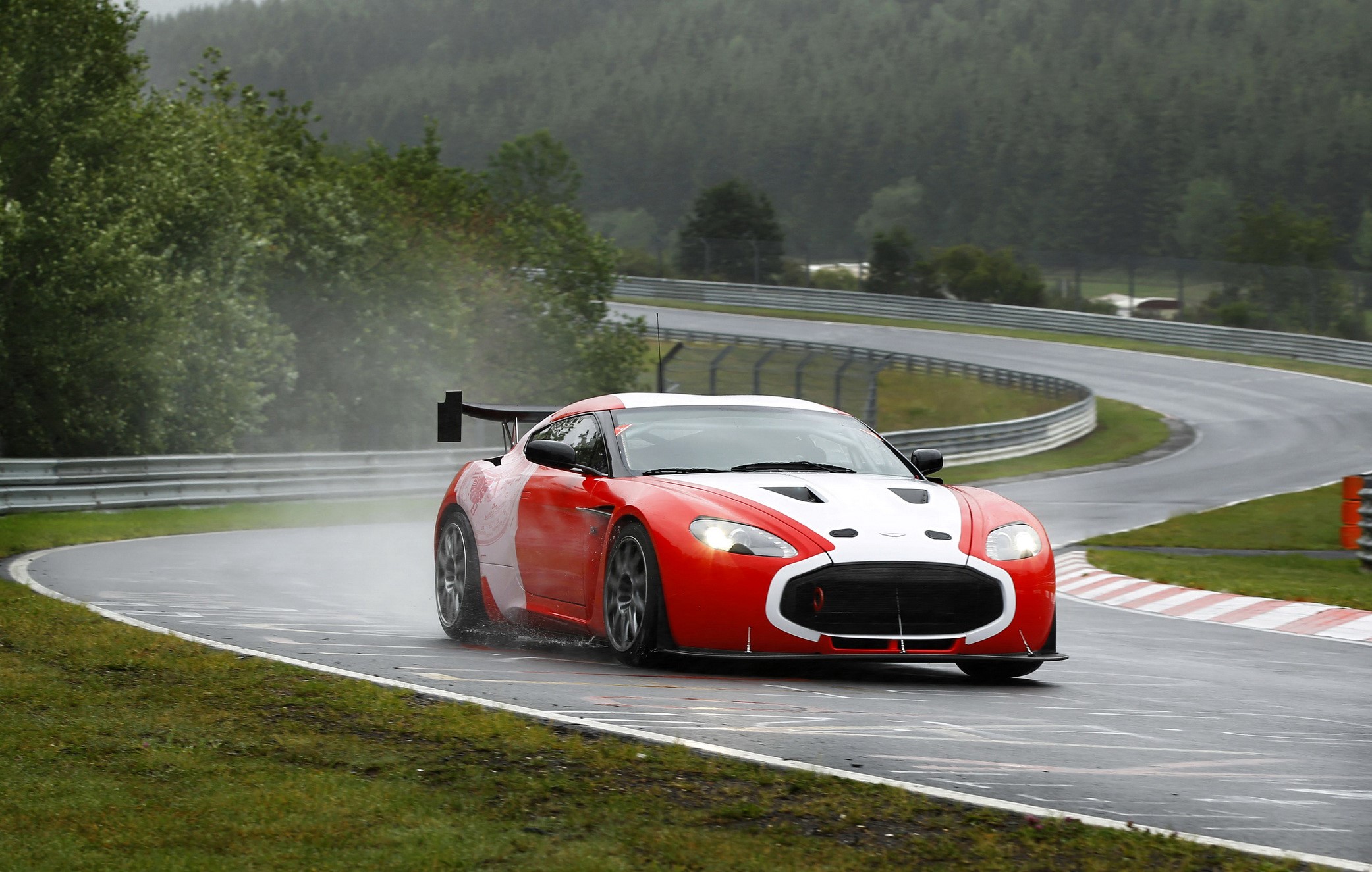 Aston Martin V12 Zagato racing on a wet track HD Wallpaper