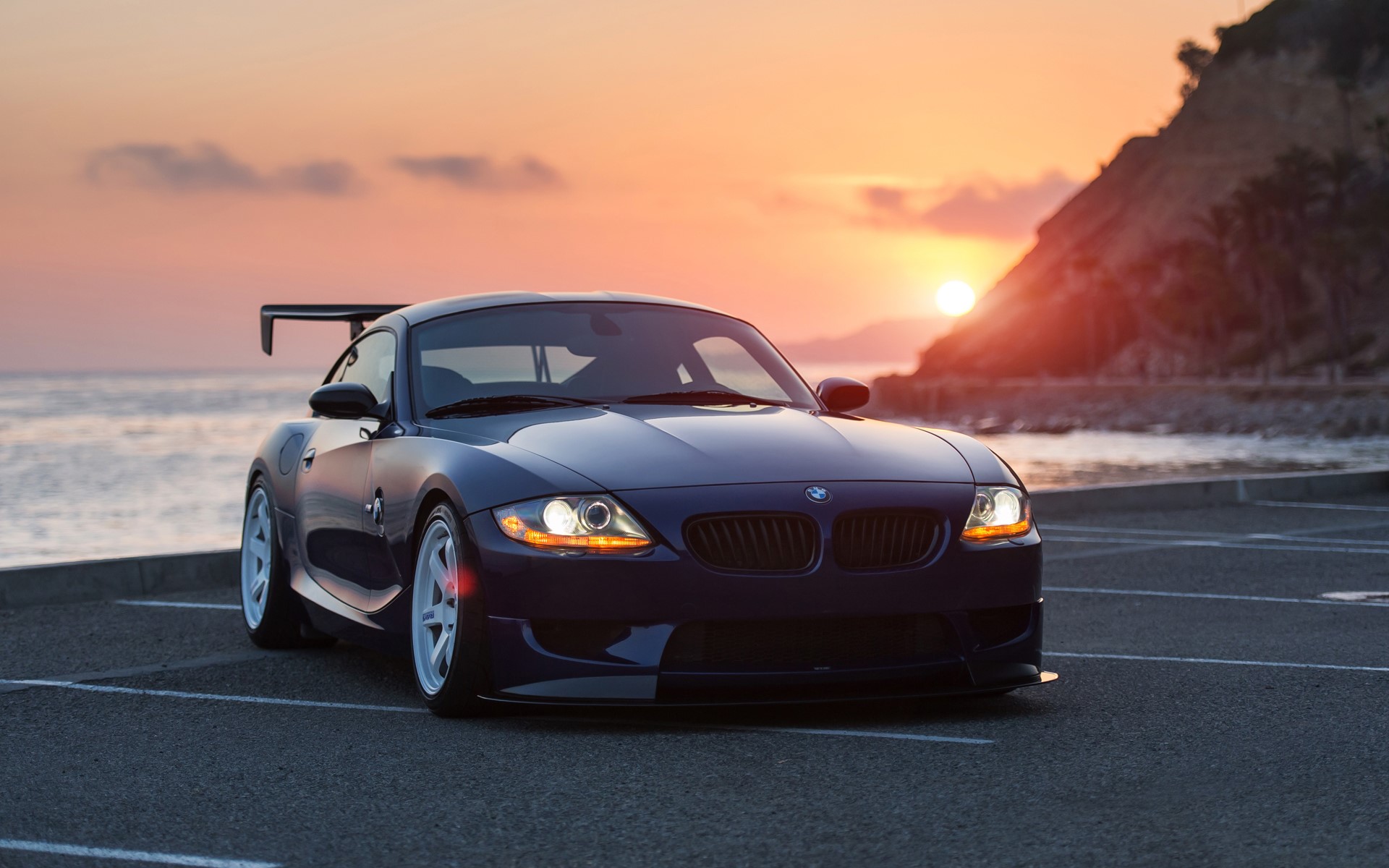 BMW Z4 with a large rear spoiler at sunset HD Wallpaper