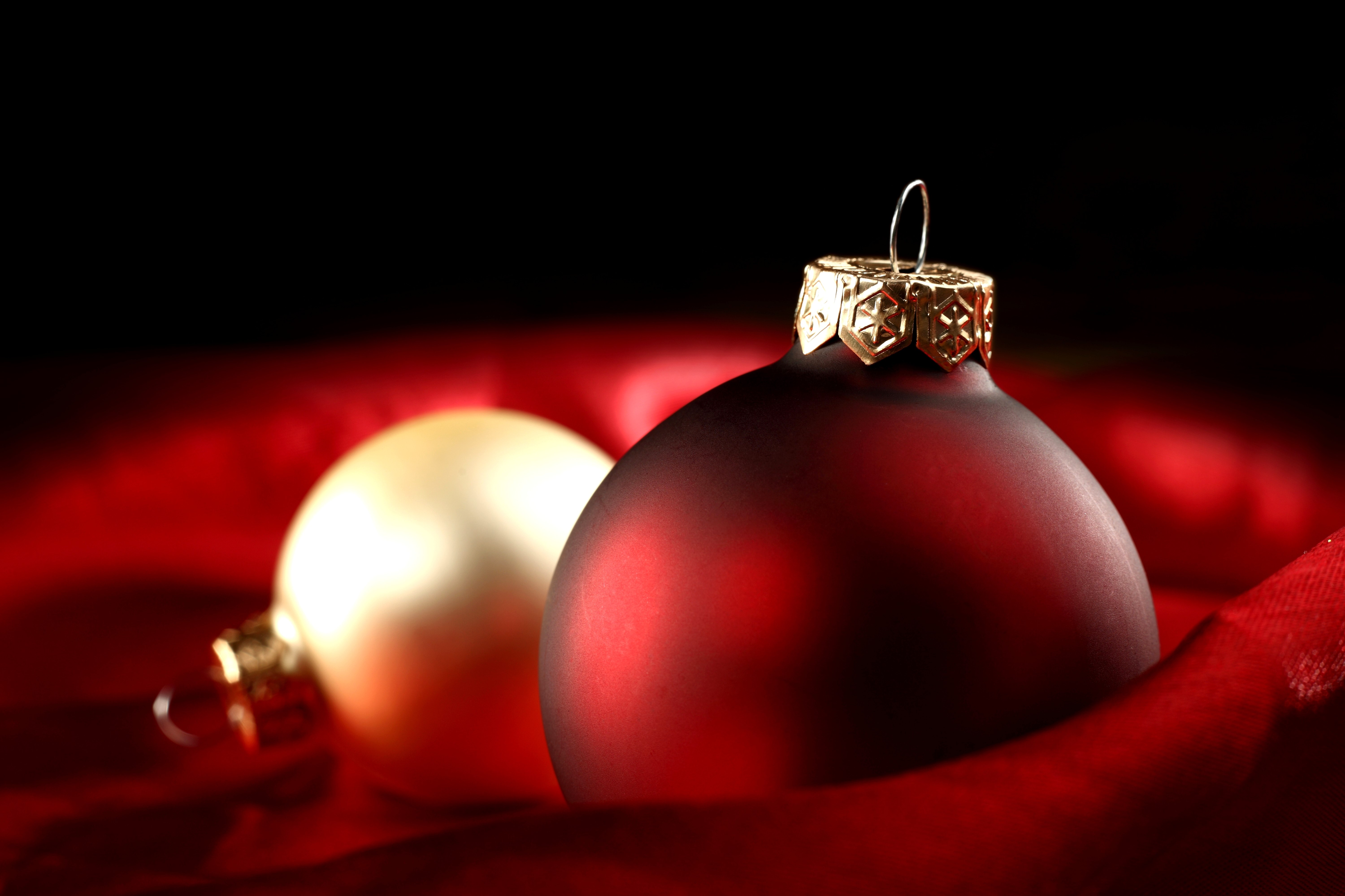 Christmas ornaments on red fabric HD Wallpaper