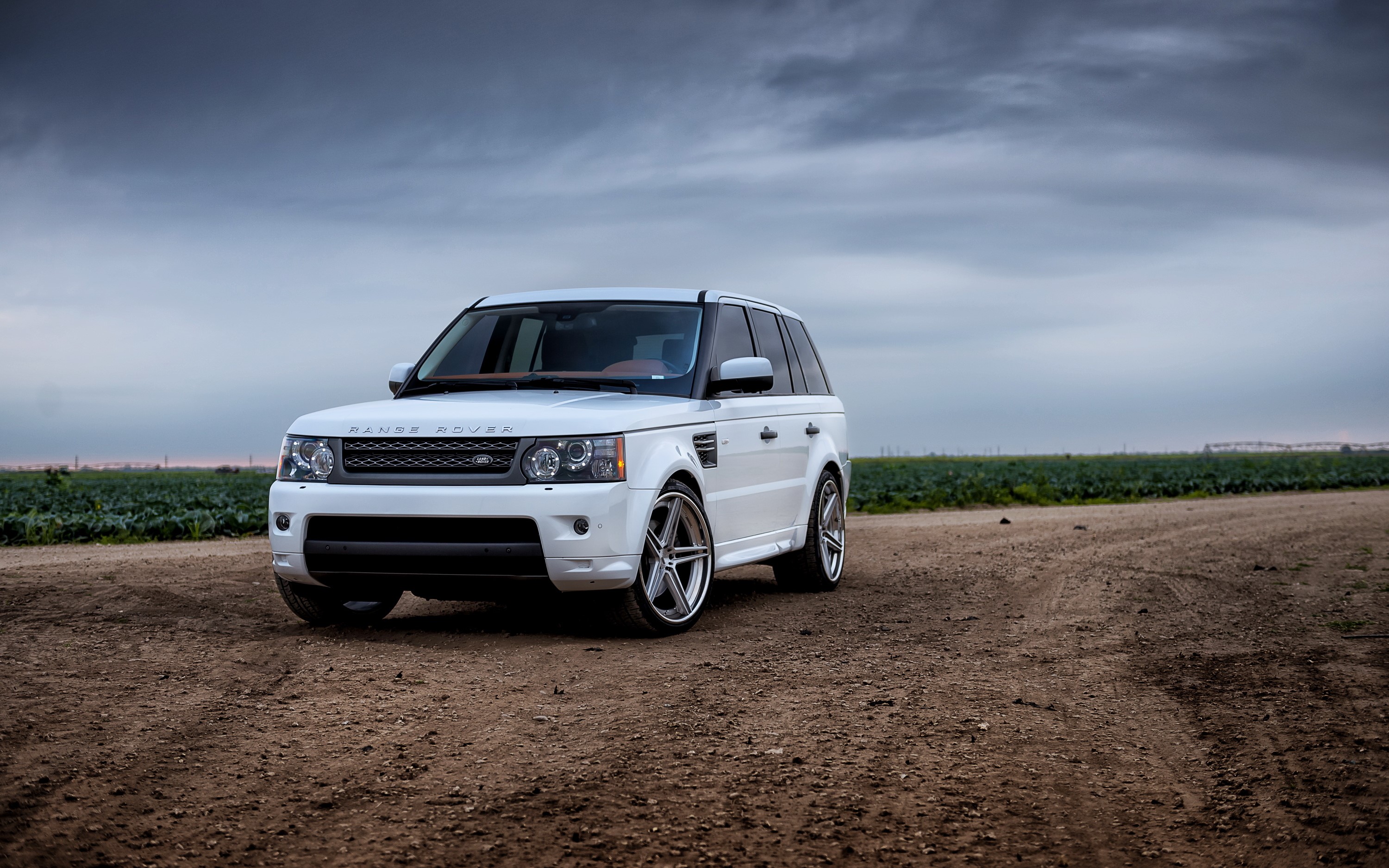 White Range Rover Sport on a dirt road HD Wallpaper