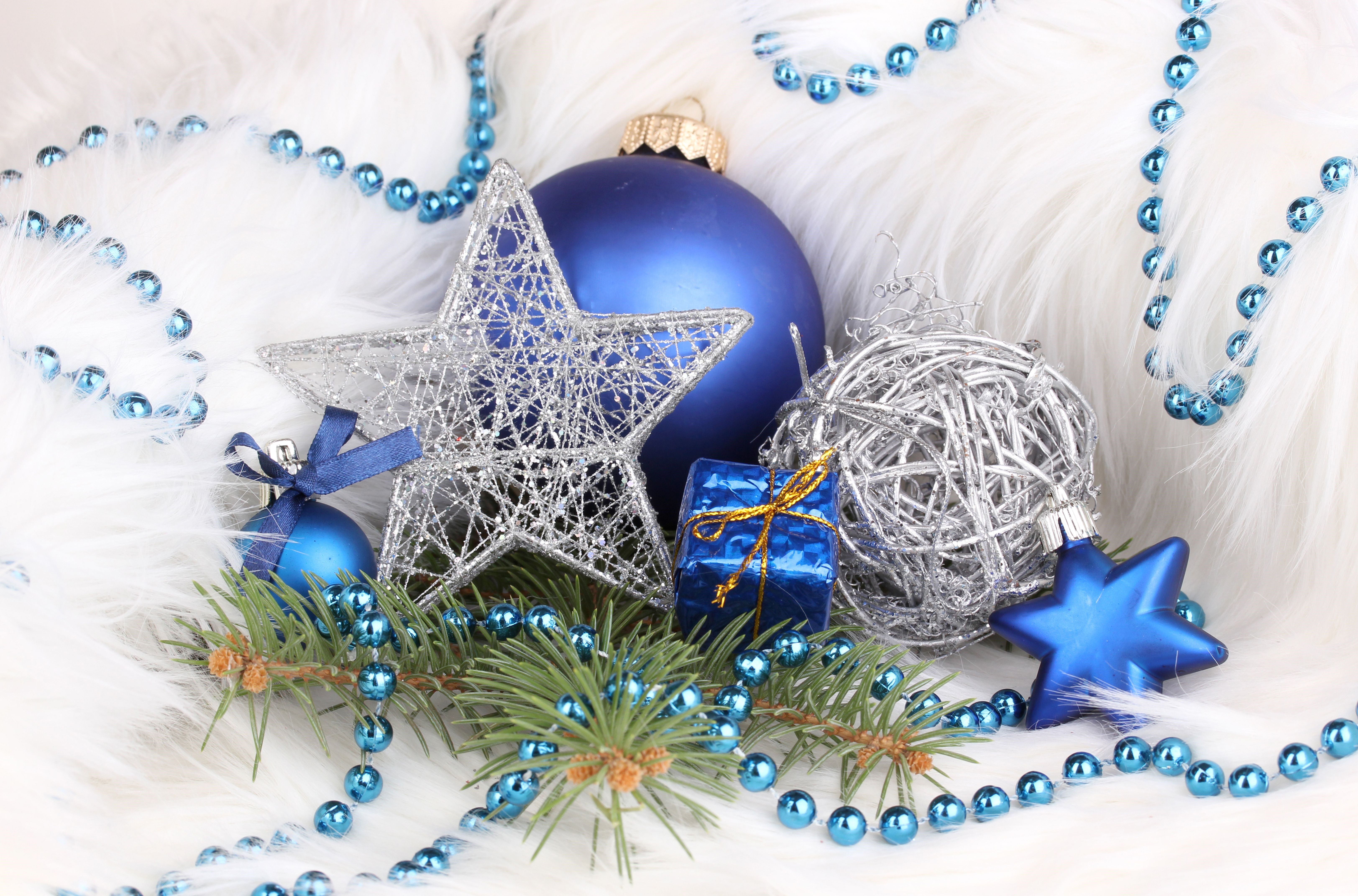 Christmas ornaments and decorations on white fur HD Wallpaper