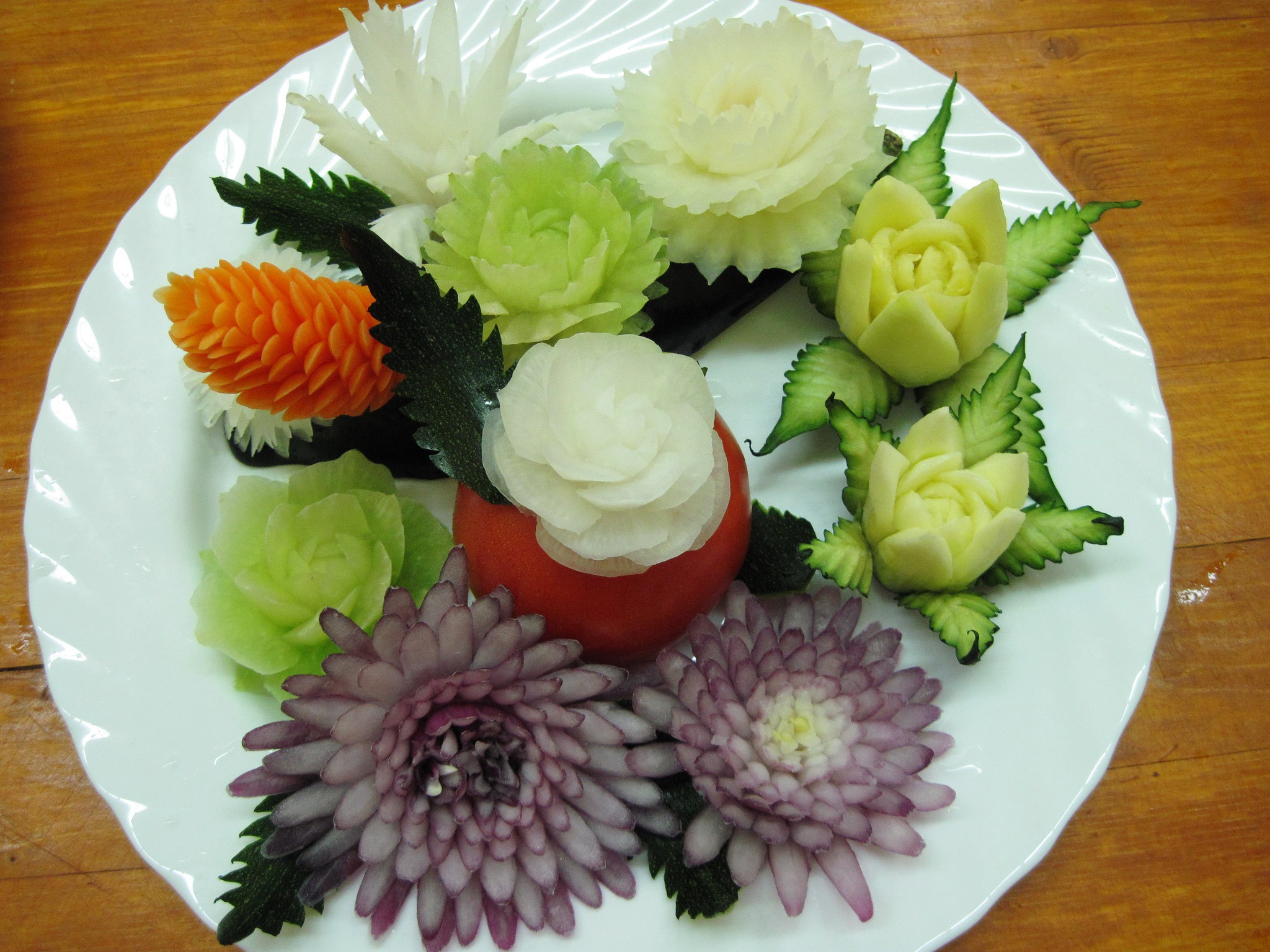 Carved vegetables and fruits on a white plate HD Wallpaper