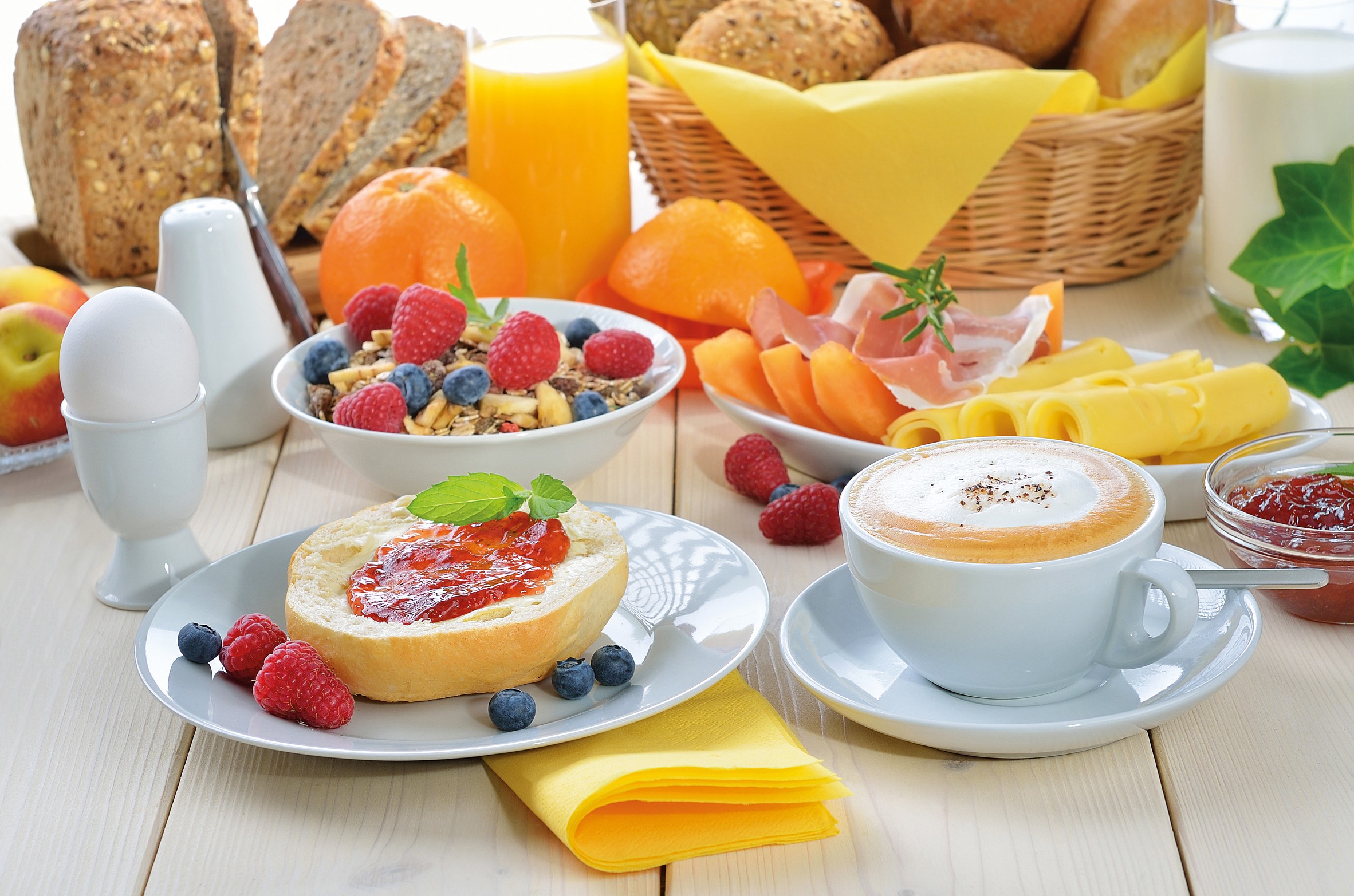 Breakfast spread with coffee, bread, fruit, and muesli HD Wallpaper