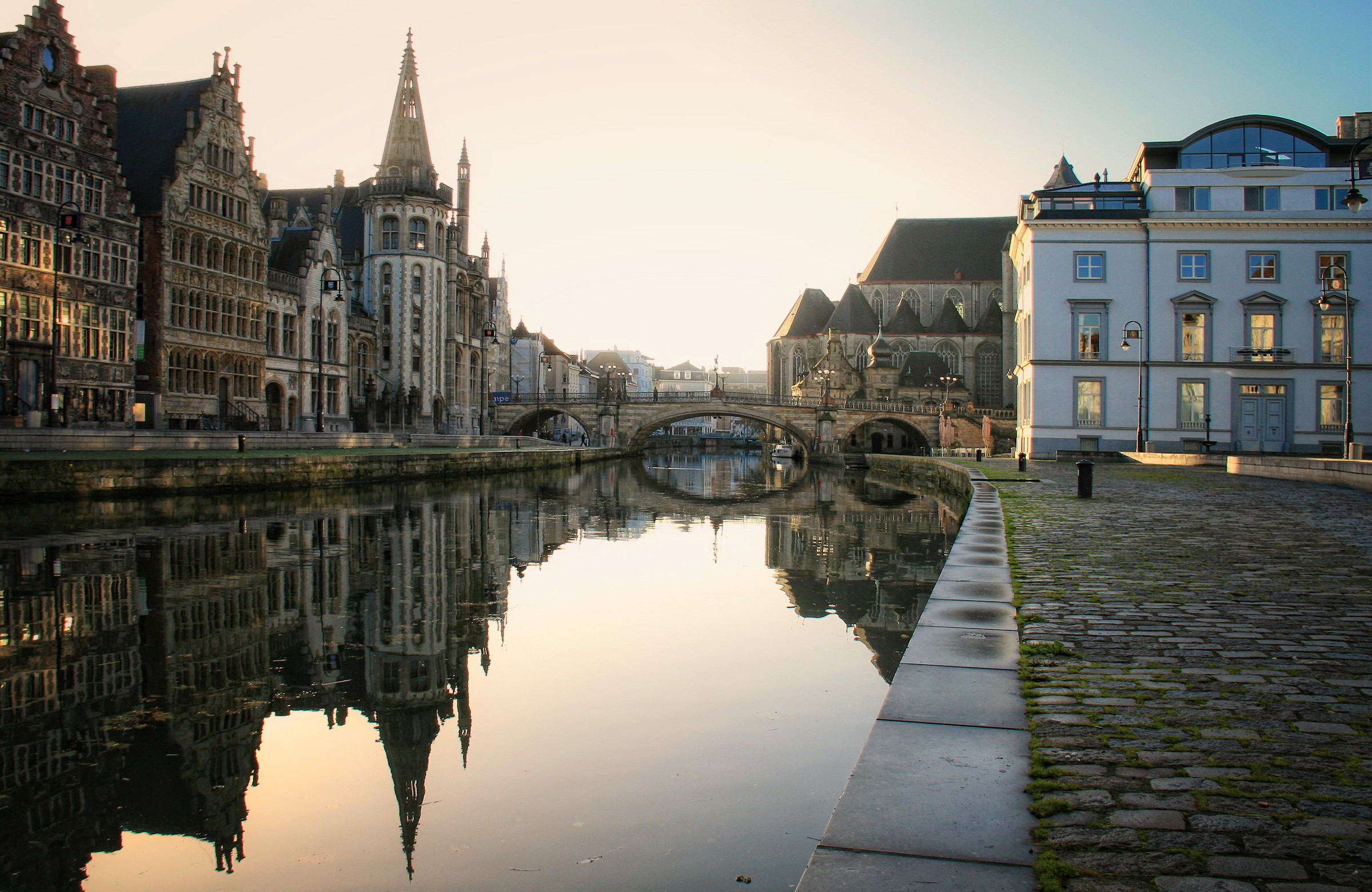 Canal in Ghent, Belgium with historic buildings and bridge HD Wallpaper