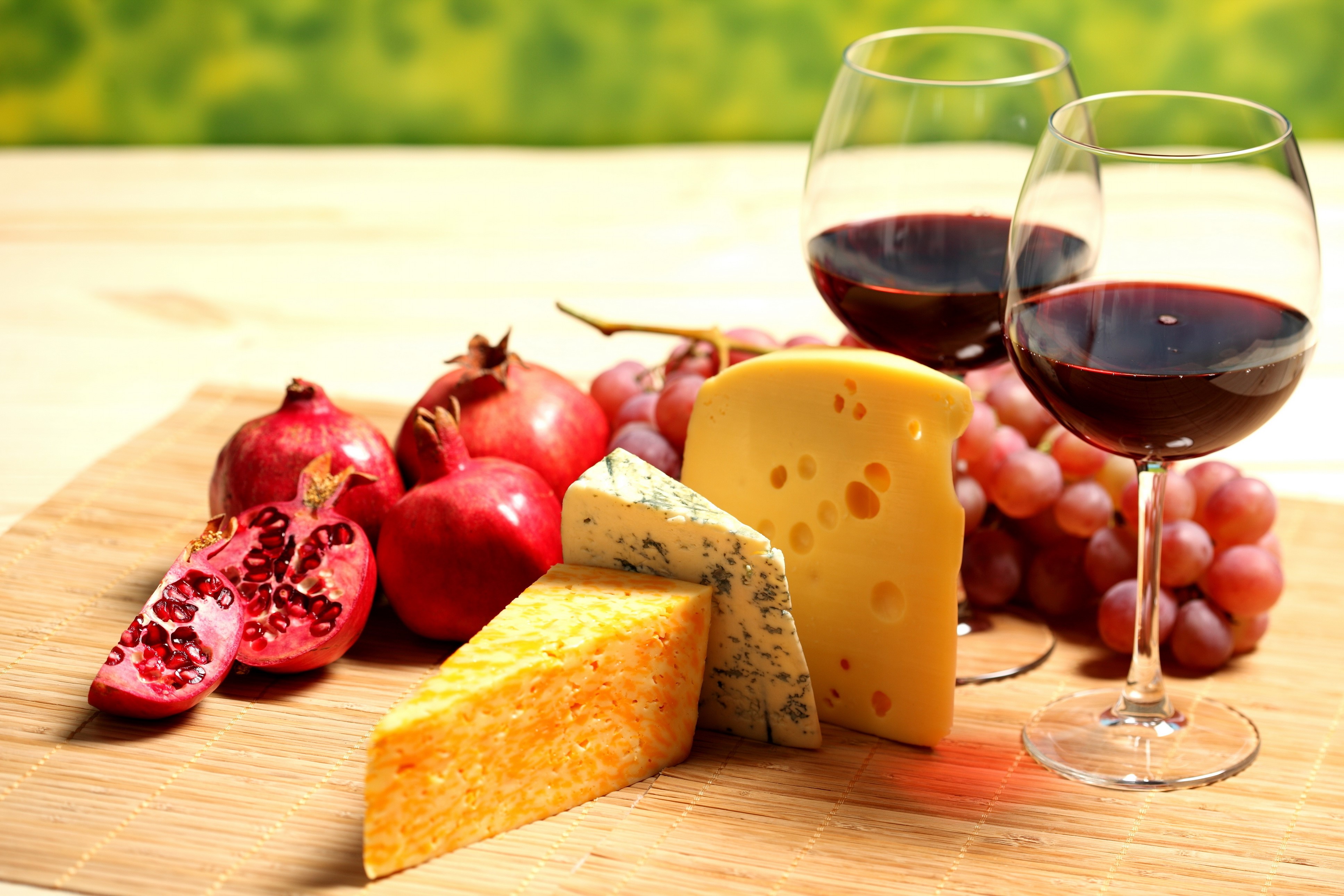 Still-life of cheese, grapes, pomegranates, and wine HD Wallpaper