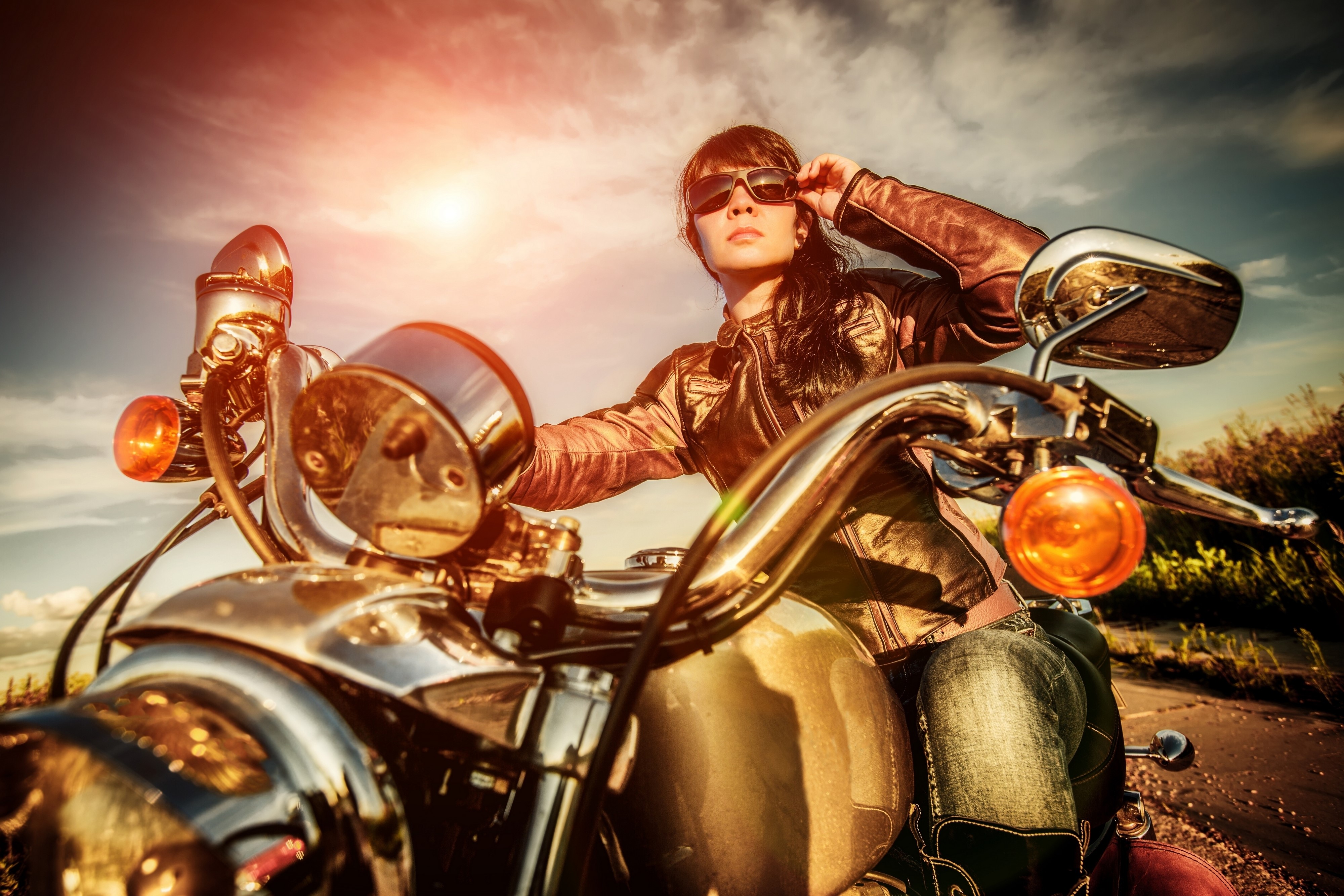 Woman in sunglasses on a motorcycle HD Wallpaper