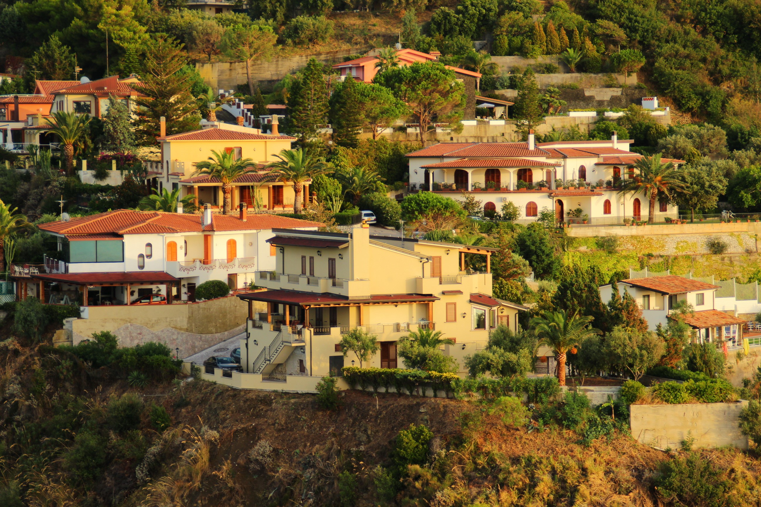 Houses on a hillside in Capo Orlando, Sicily, Italy HD Wallpaper