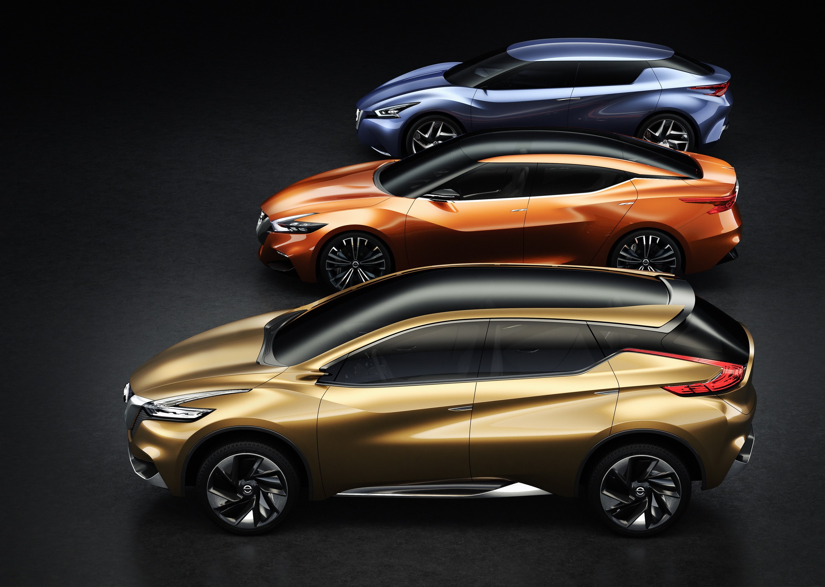 Three Nissan concept cars in metallic colors HD Wallpaper