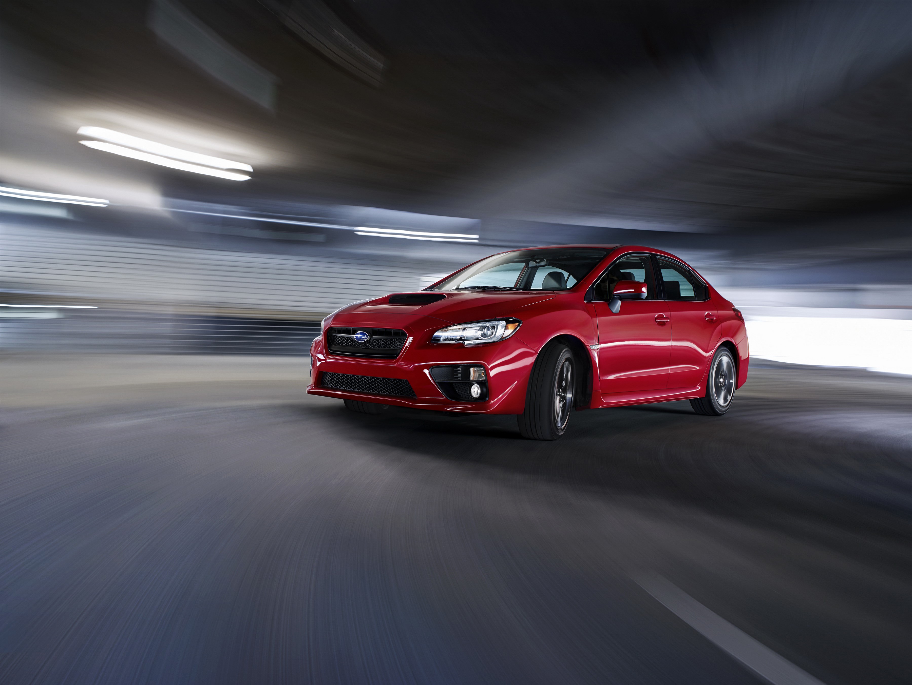 Red Subaru WRX driving through a tunnel HD Wallpaper