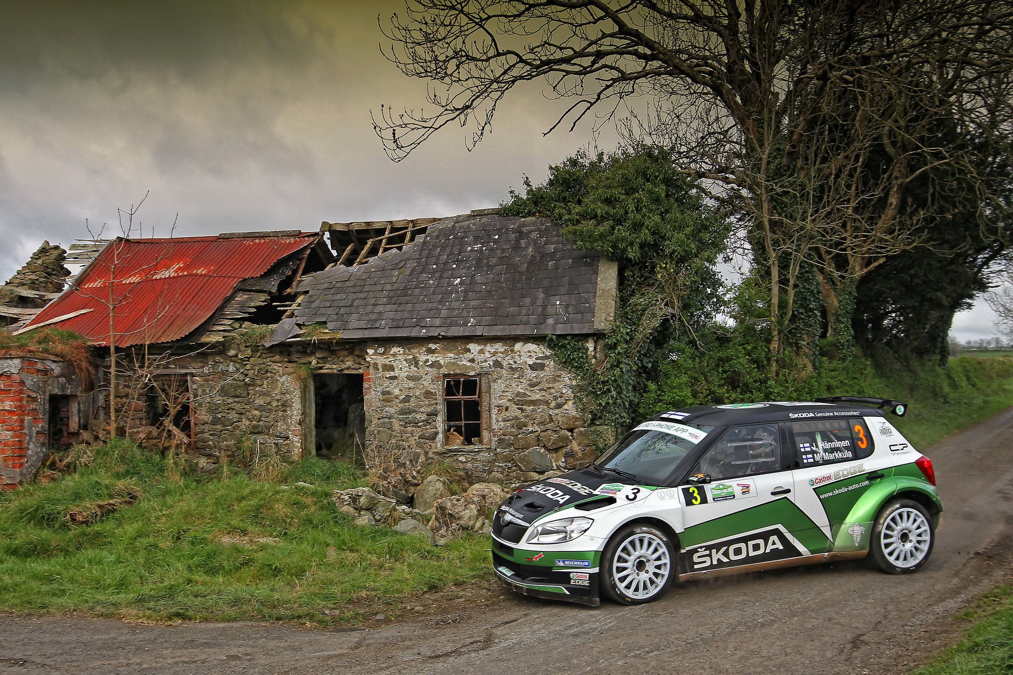 Skoda Fabia S2000 rally car near abandoned building HD Wallpaper