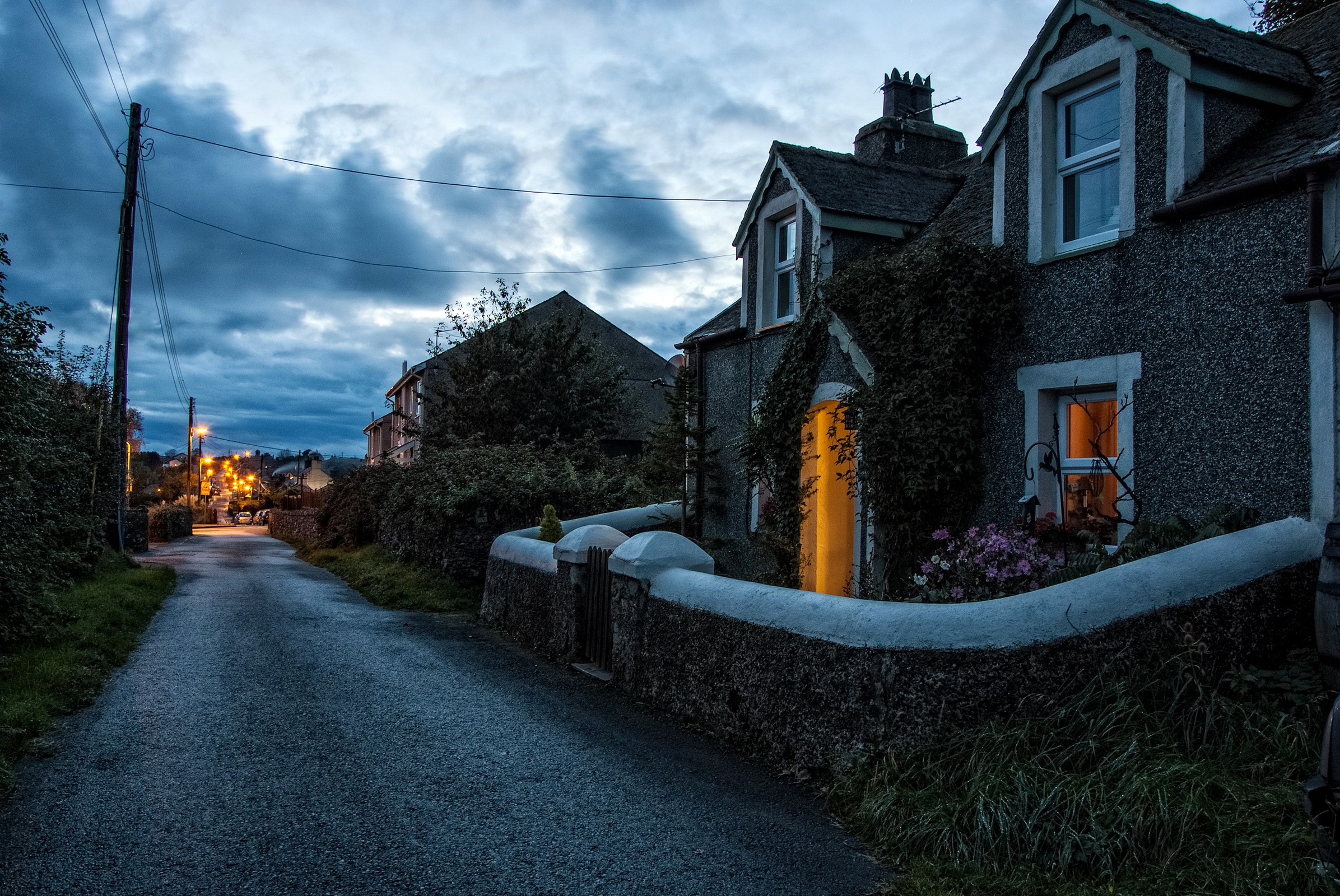 Houses on a street at night in Newborough, United Kingdom HD Wallpaper