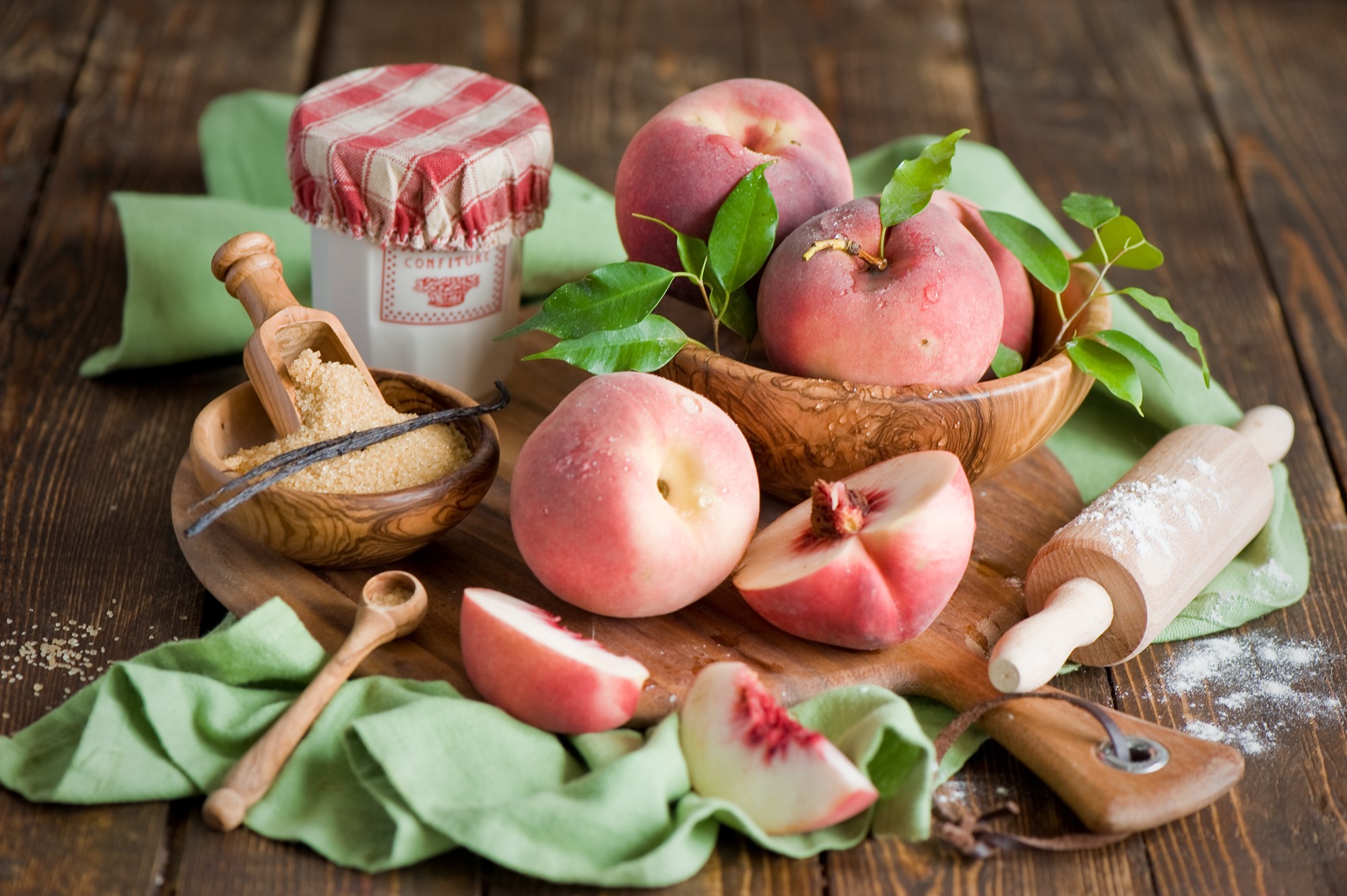 Peaches and baking ingredients on a wooden table HD Wallpaper