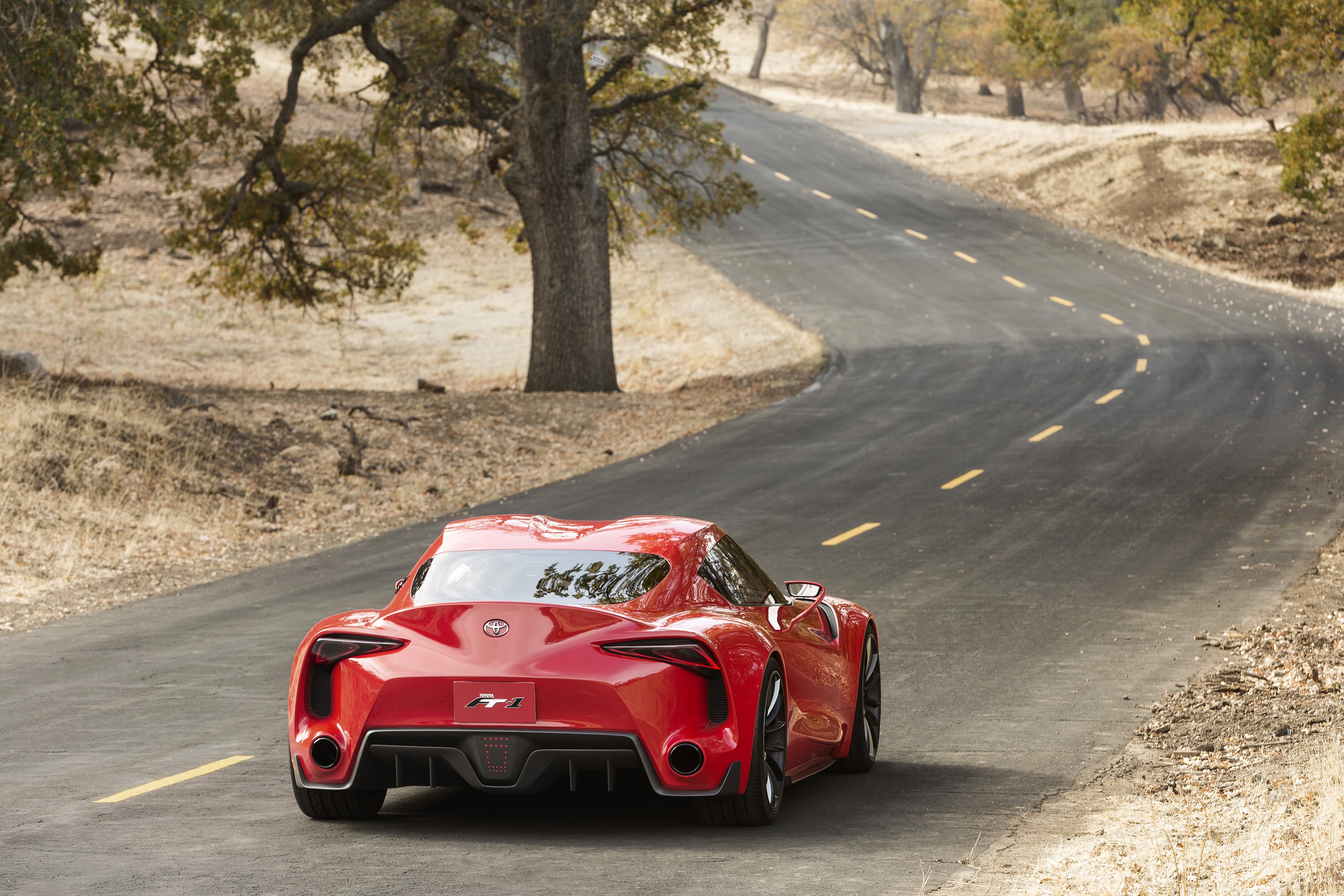 Red Toyota FT-1 Concept Car on a Winding Road HD Wallpaper