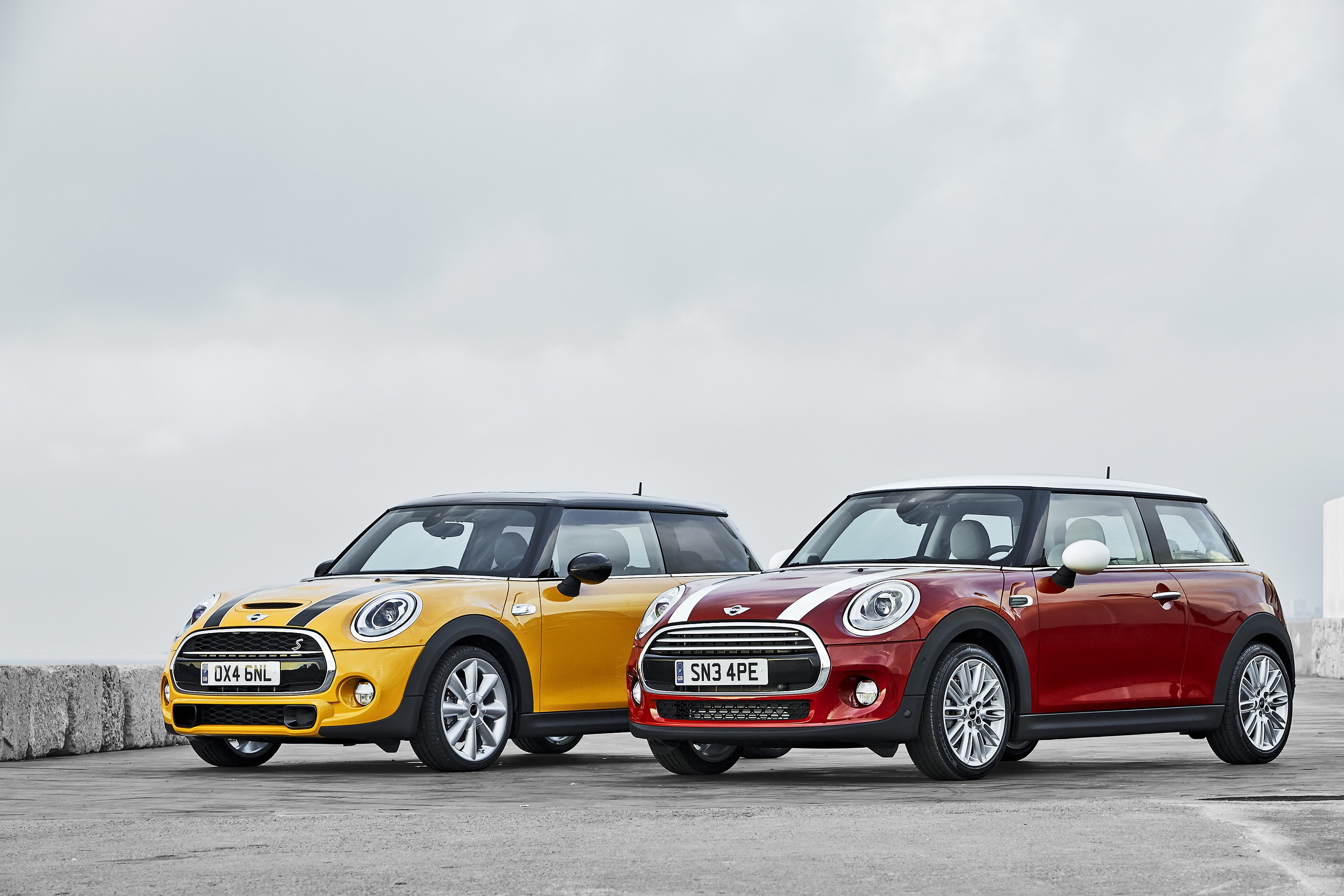 Two Mini Cooper S cars, yellow and red HD Wallpaper