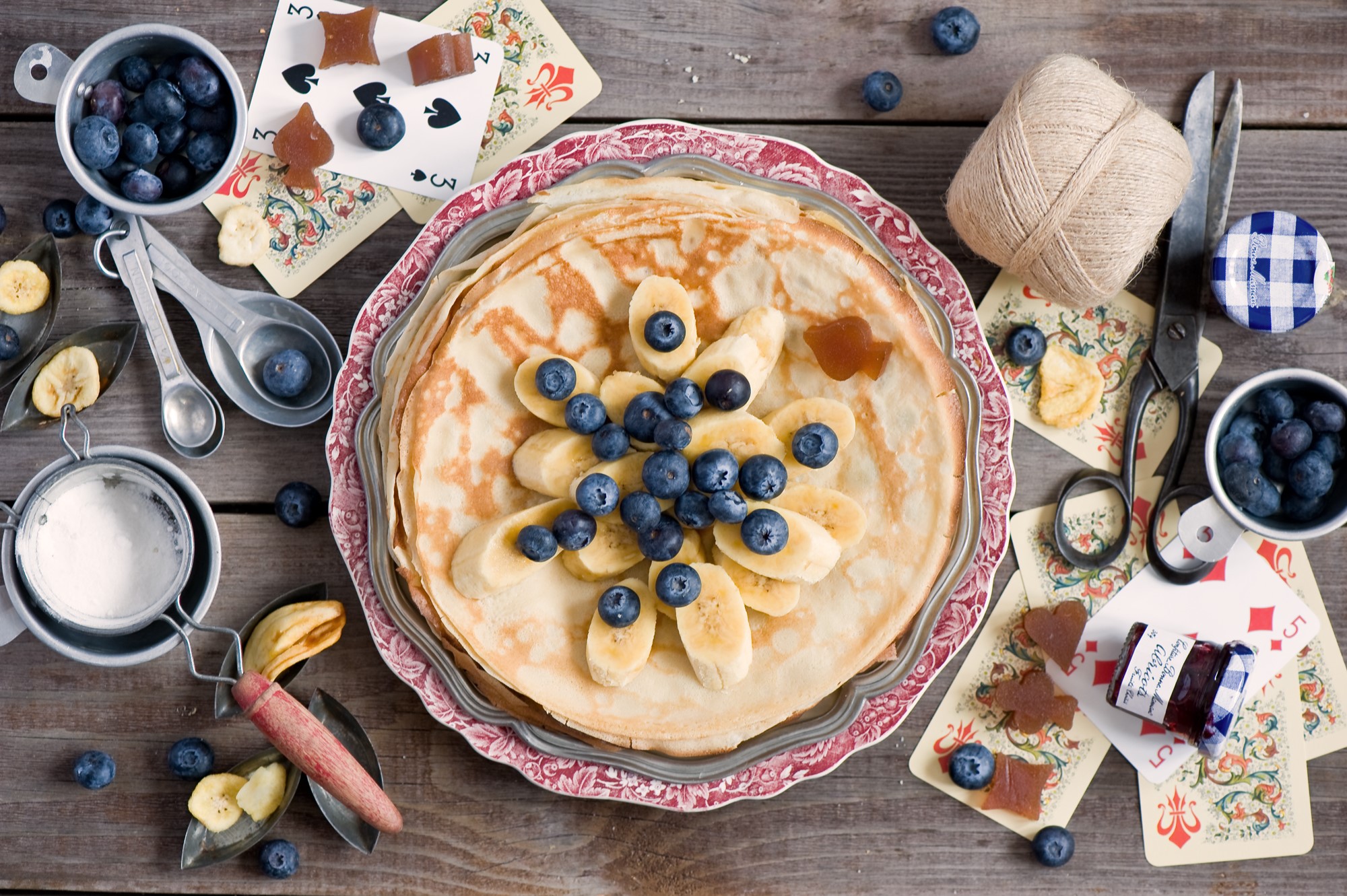 Pancakes with blueberries and bananas on a plate with cards HD Wallpaper