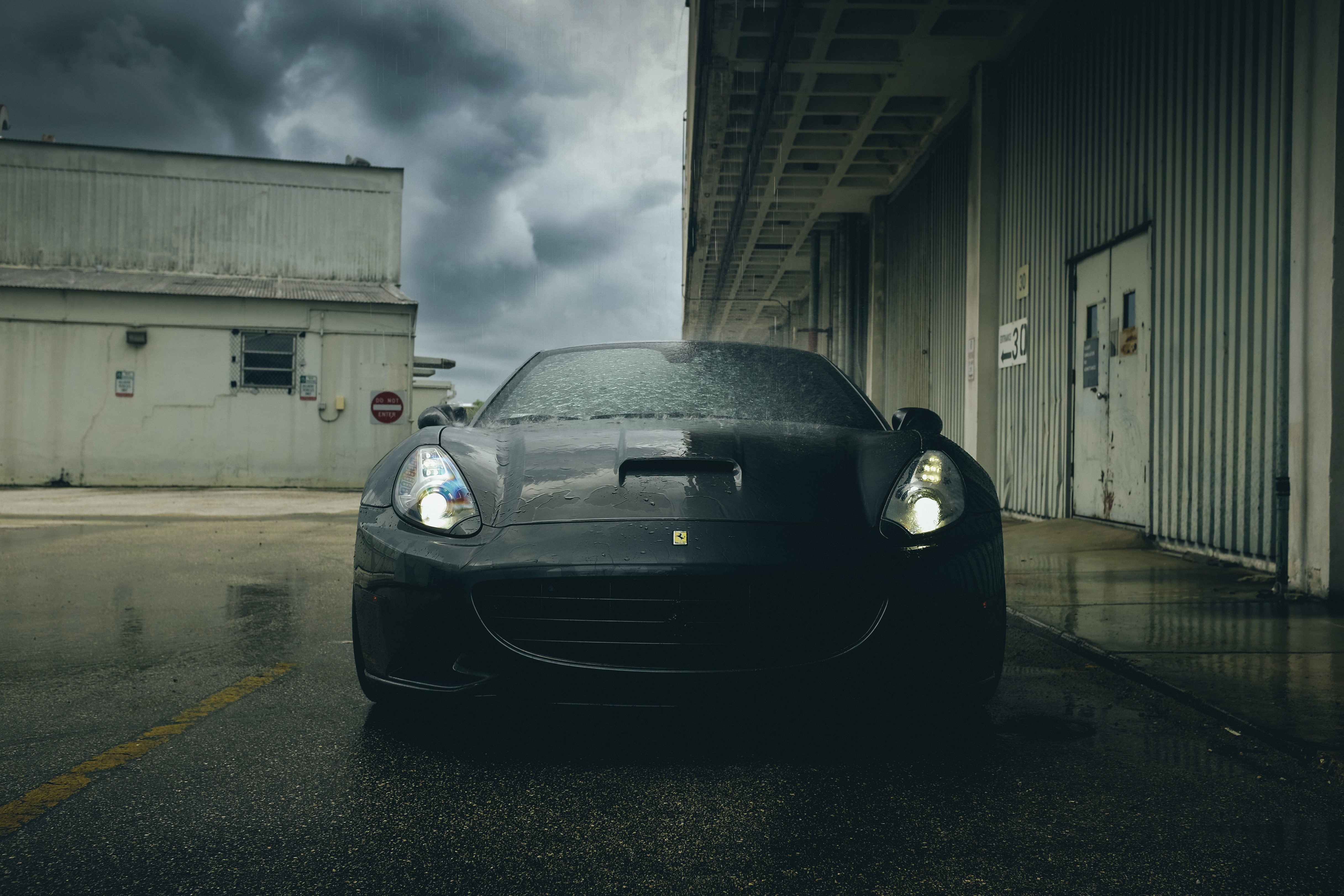 Black Ferrari in the Rain HD Wallpaper