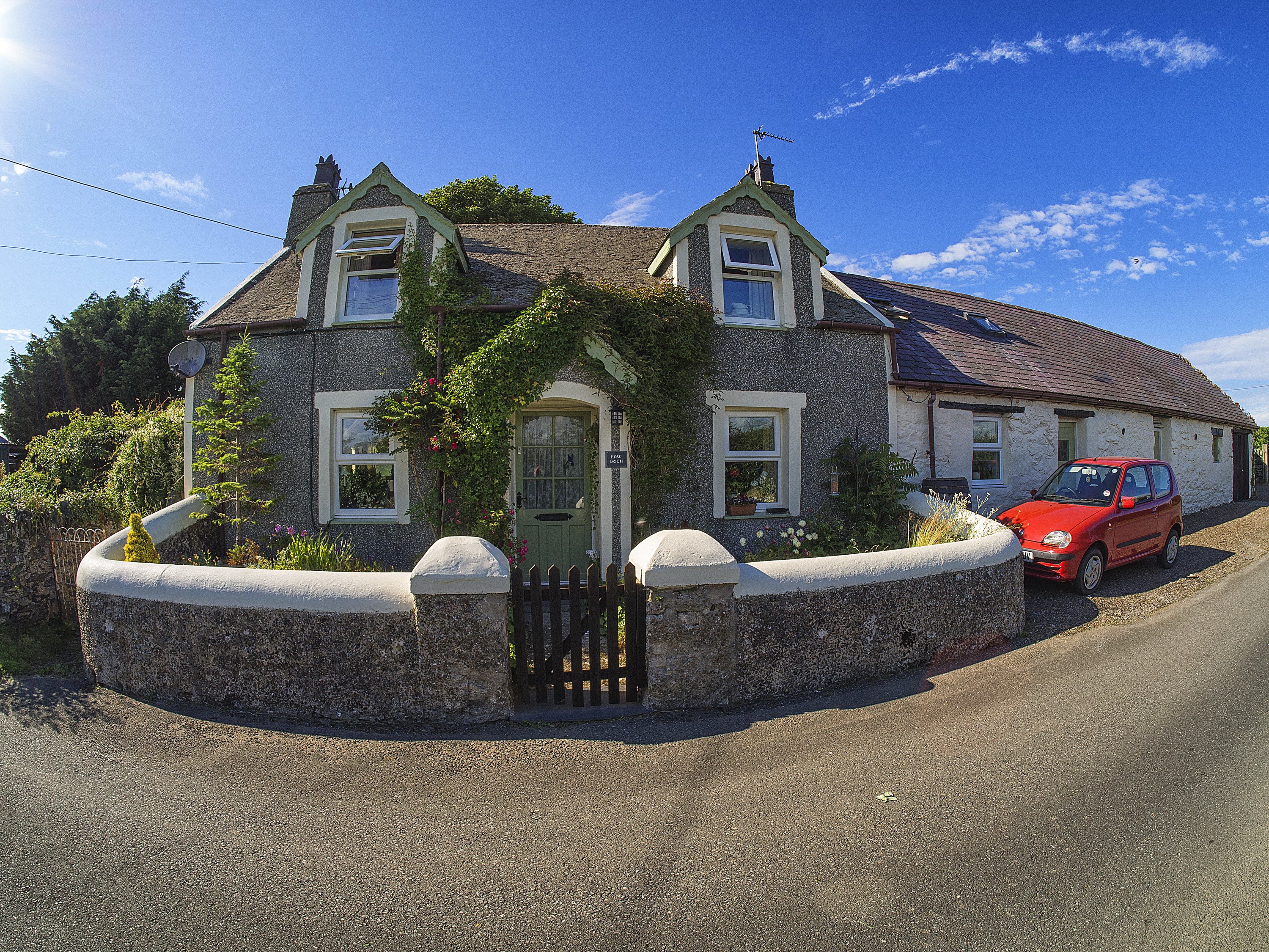 Cottage with red car parked outside HD Wallpaper
