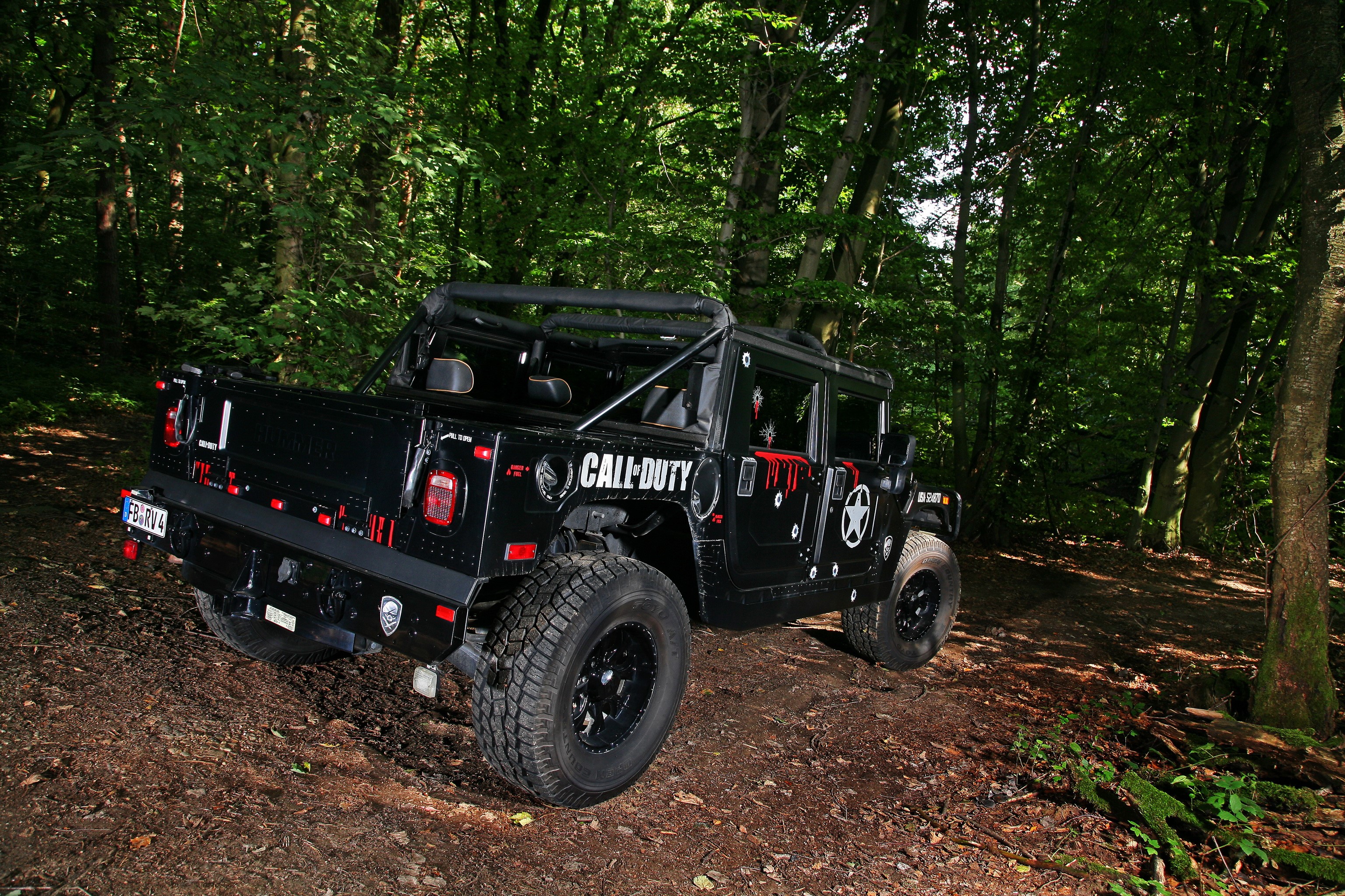 Black Hummer H1 with Call of Duty theme in forest HD Wallpaper