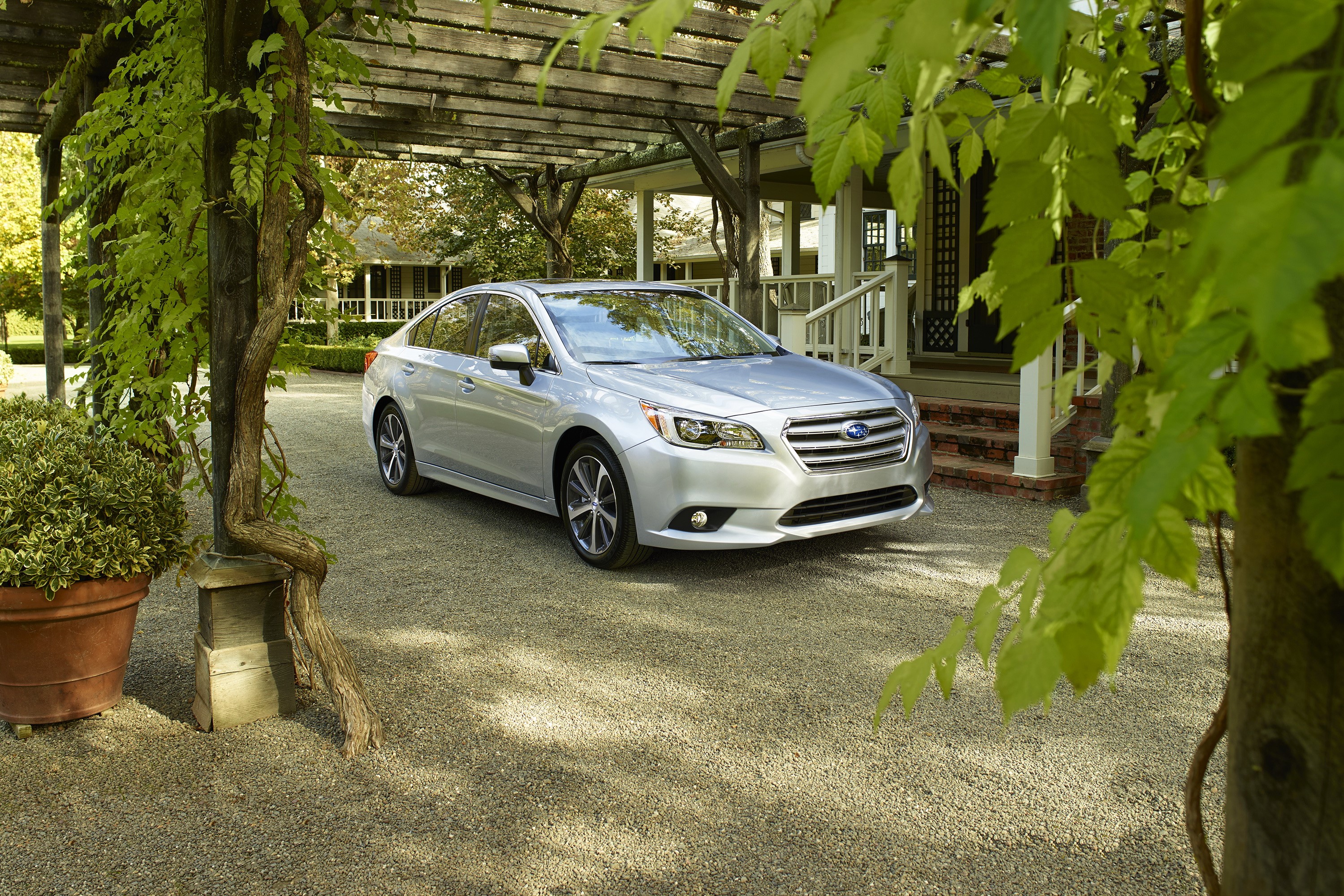 Silver 2015 Subaru Legacy sedan parked under a pergola HD Wallpaper