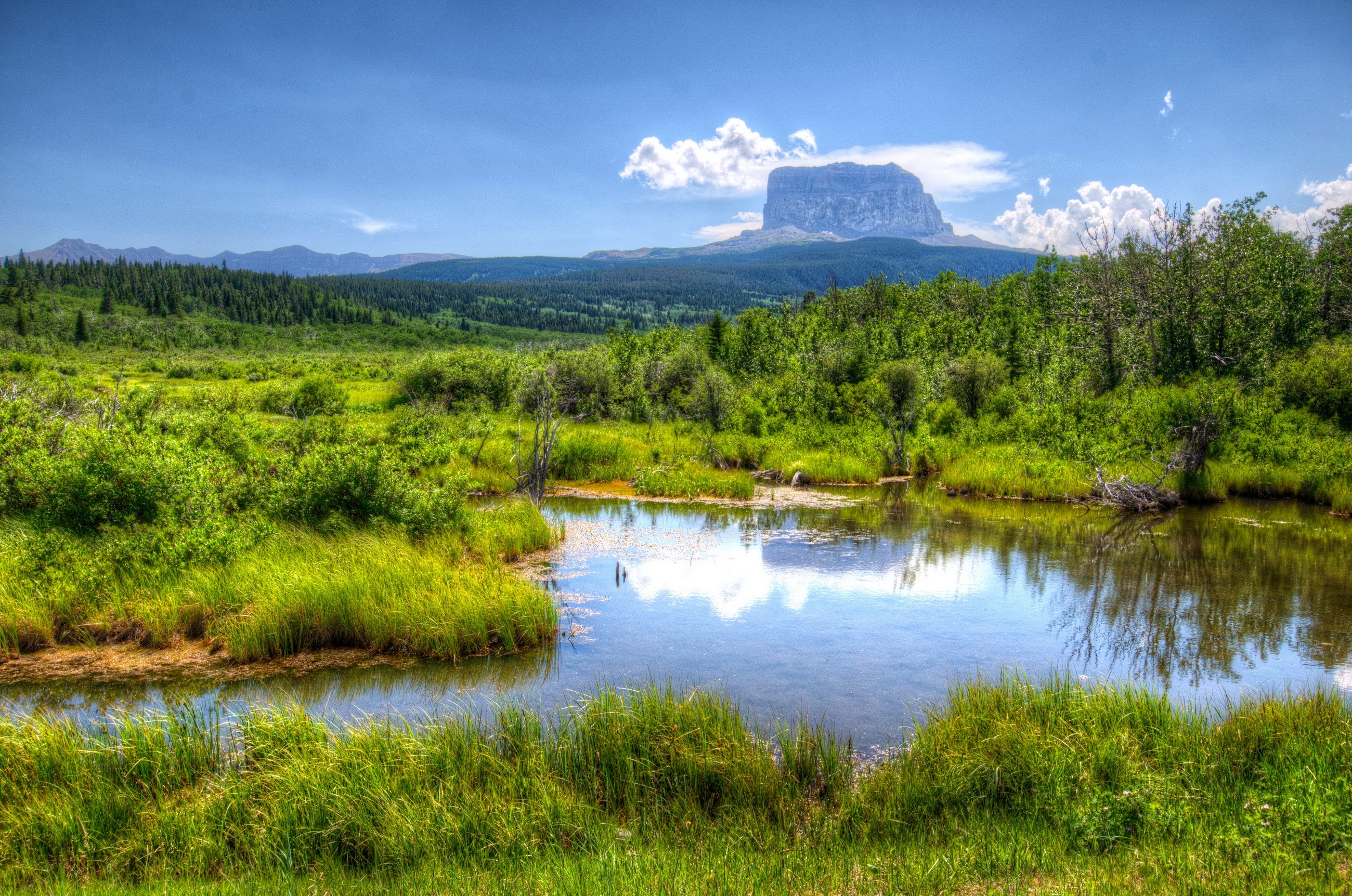 Flat-topped mountain and pond in Waterton, Canada HD Wallpaper