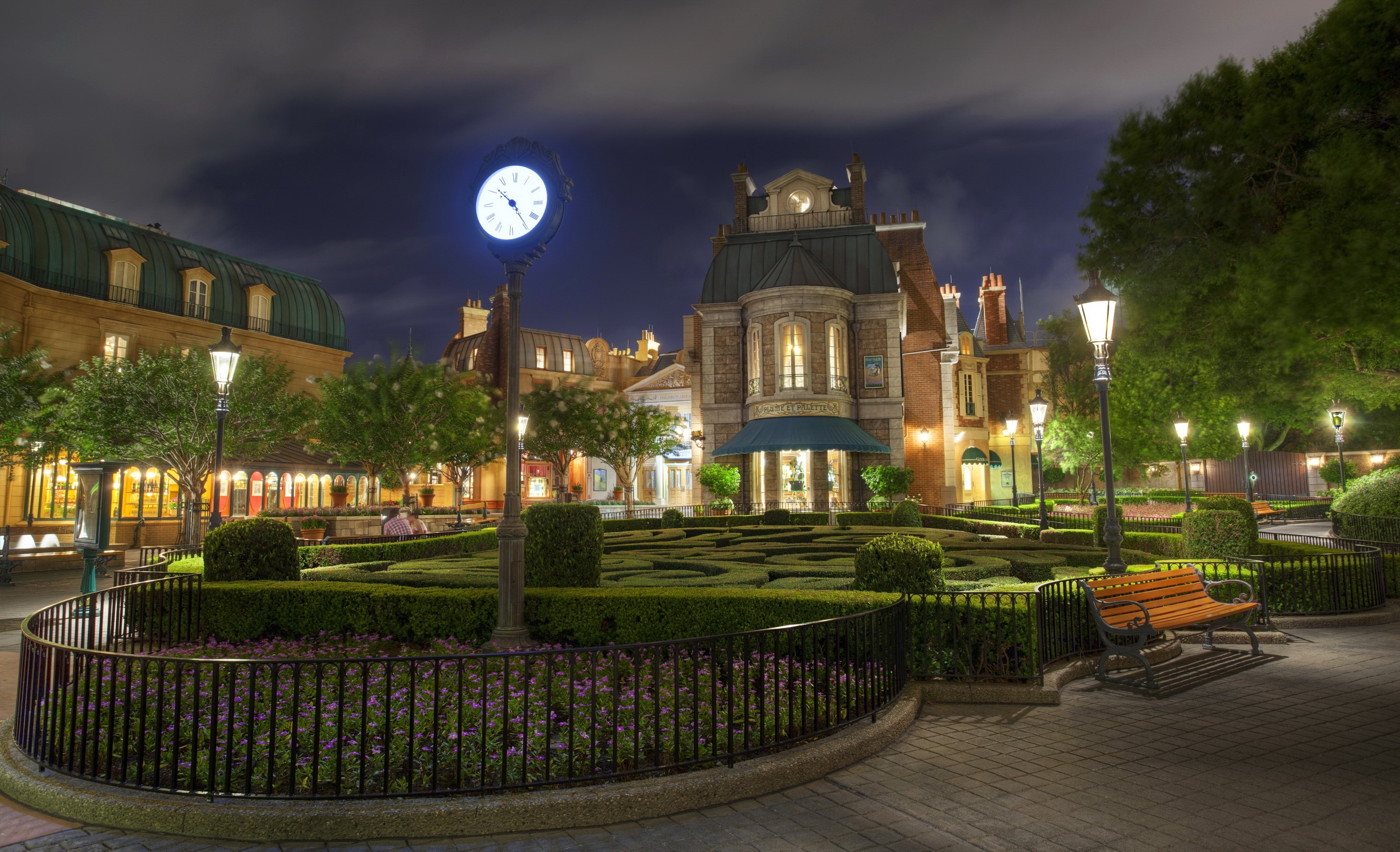 Night view of a French-themed garden with a clock tower HD Wallpaper