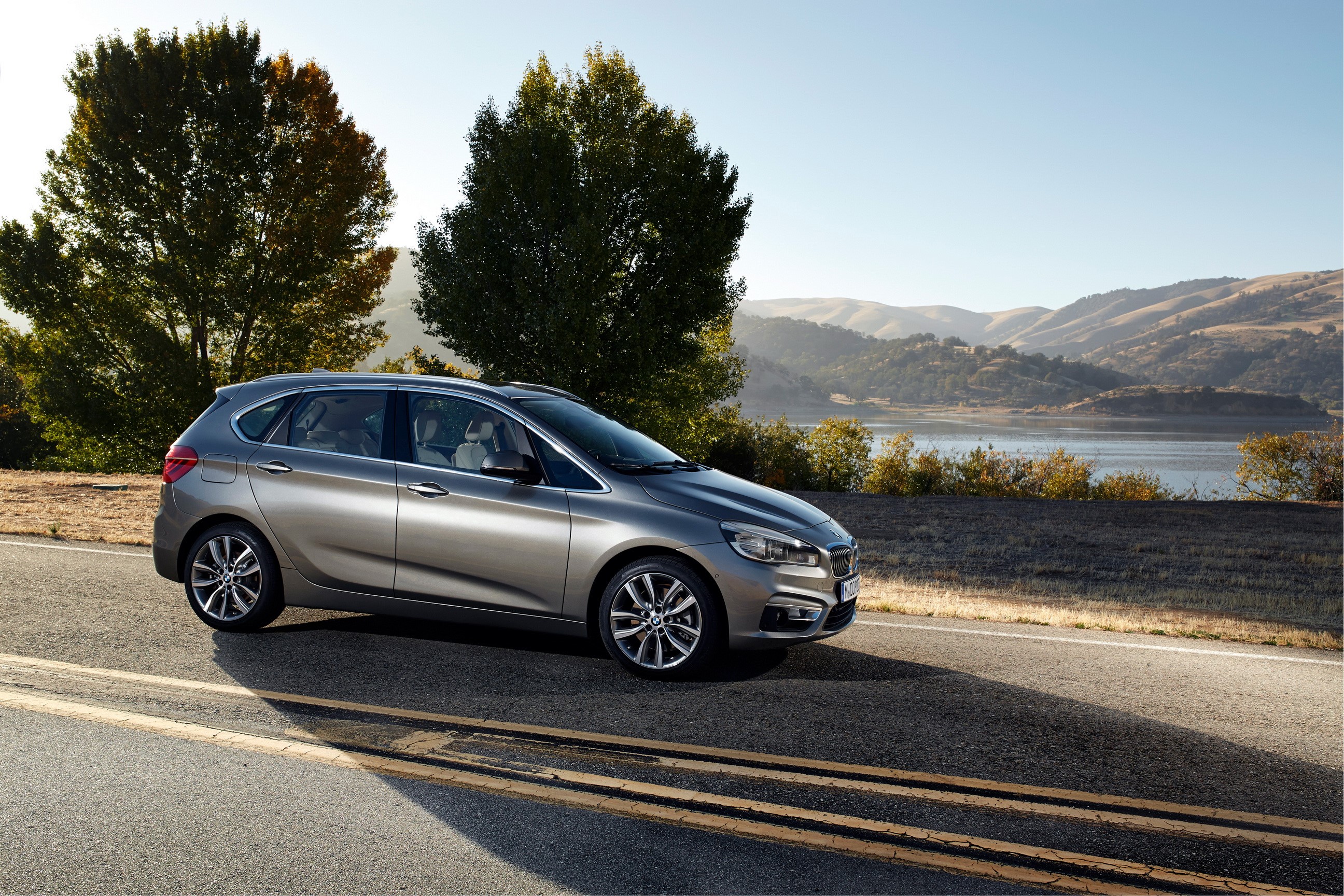 BMW 224i Active Tourer on a road HD Wallpaper