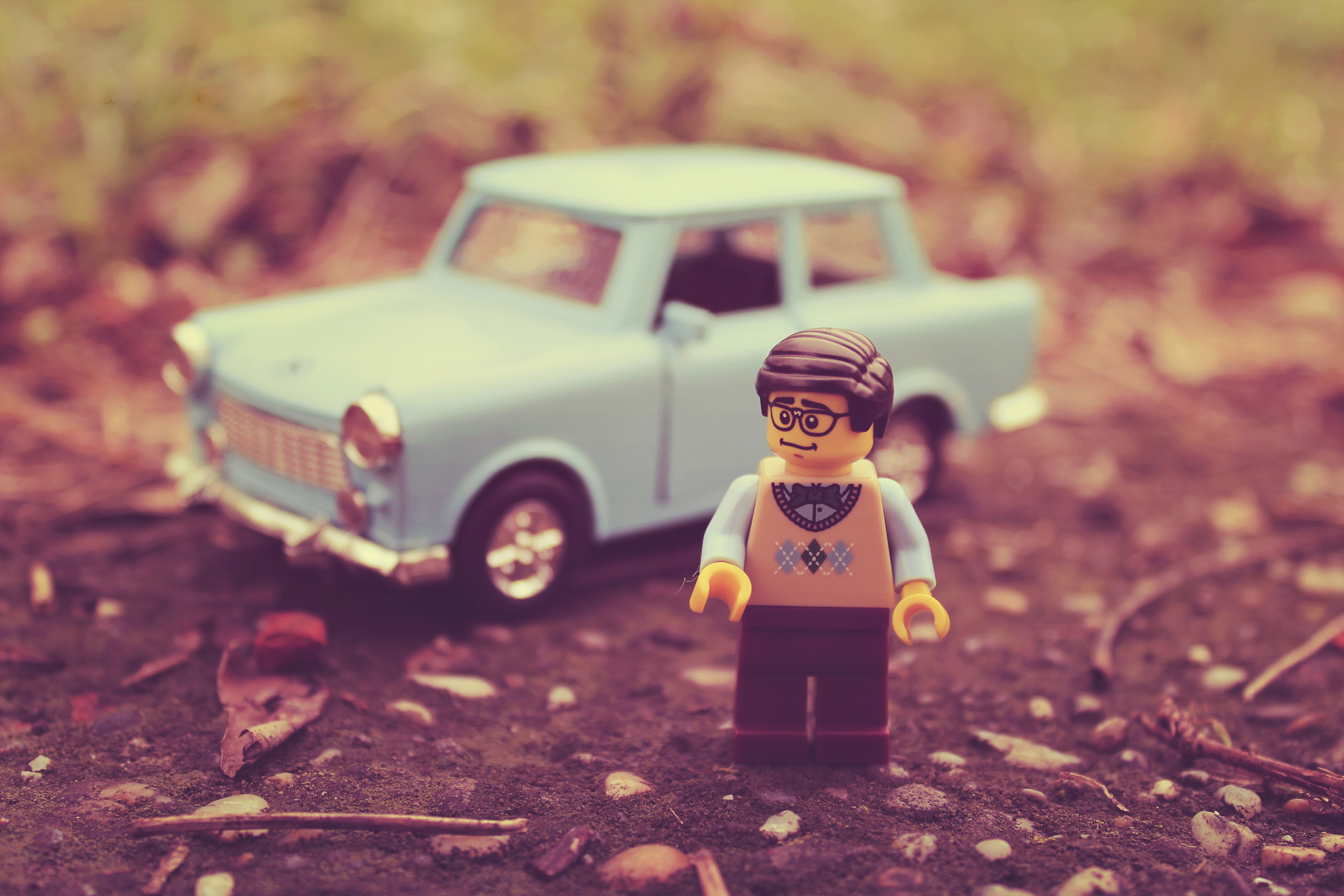 Lego man and toy car HD Wallpaper