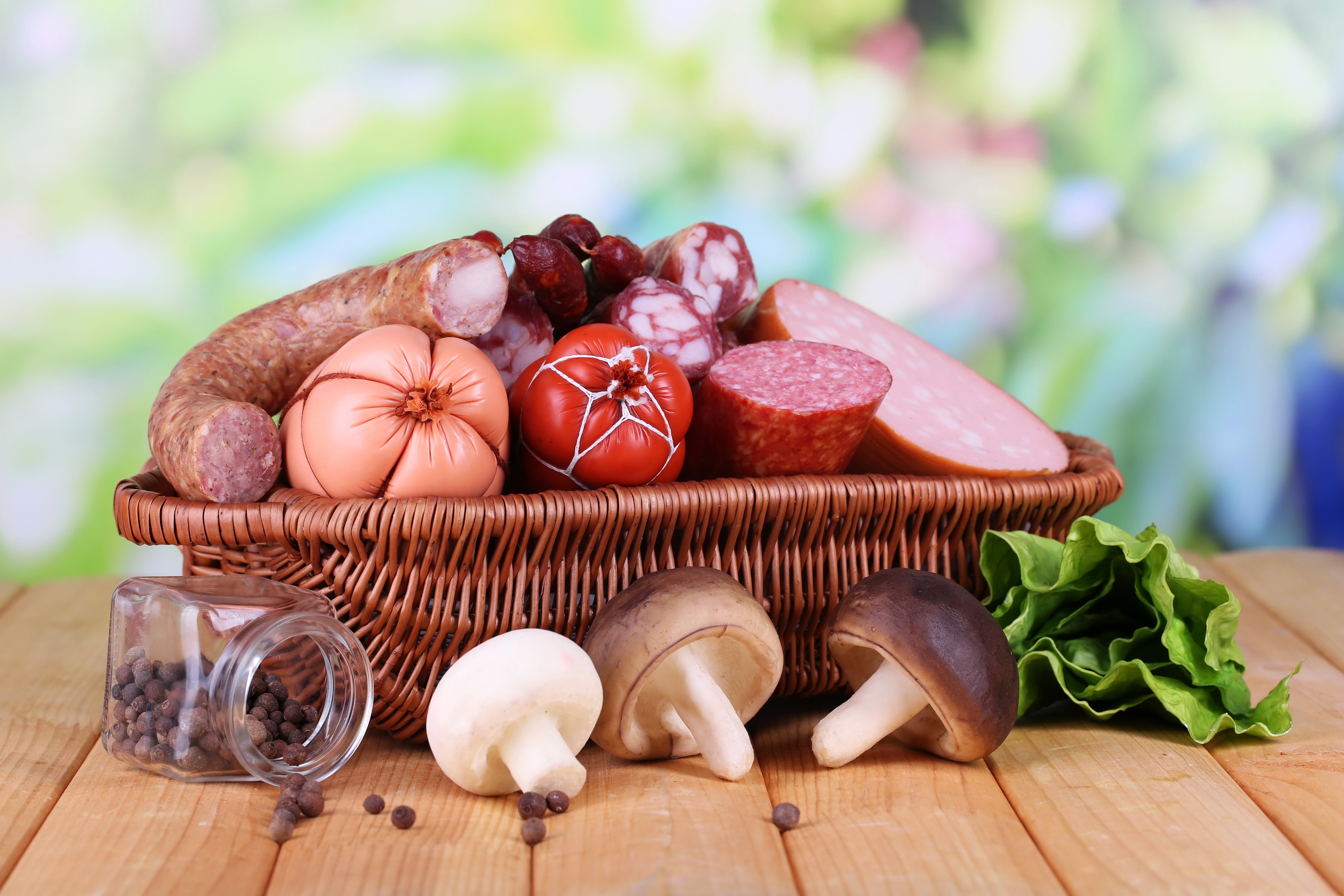 Meat products and mushrooms in a wicker basket HD Wallpaper