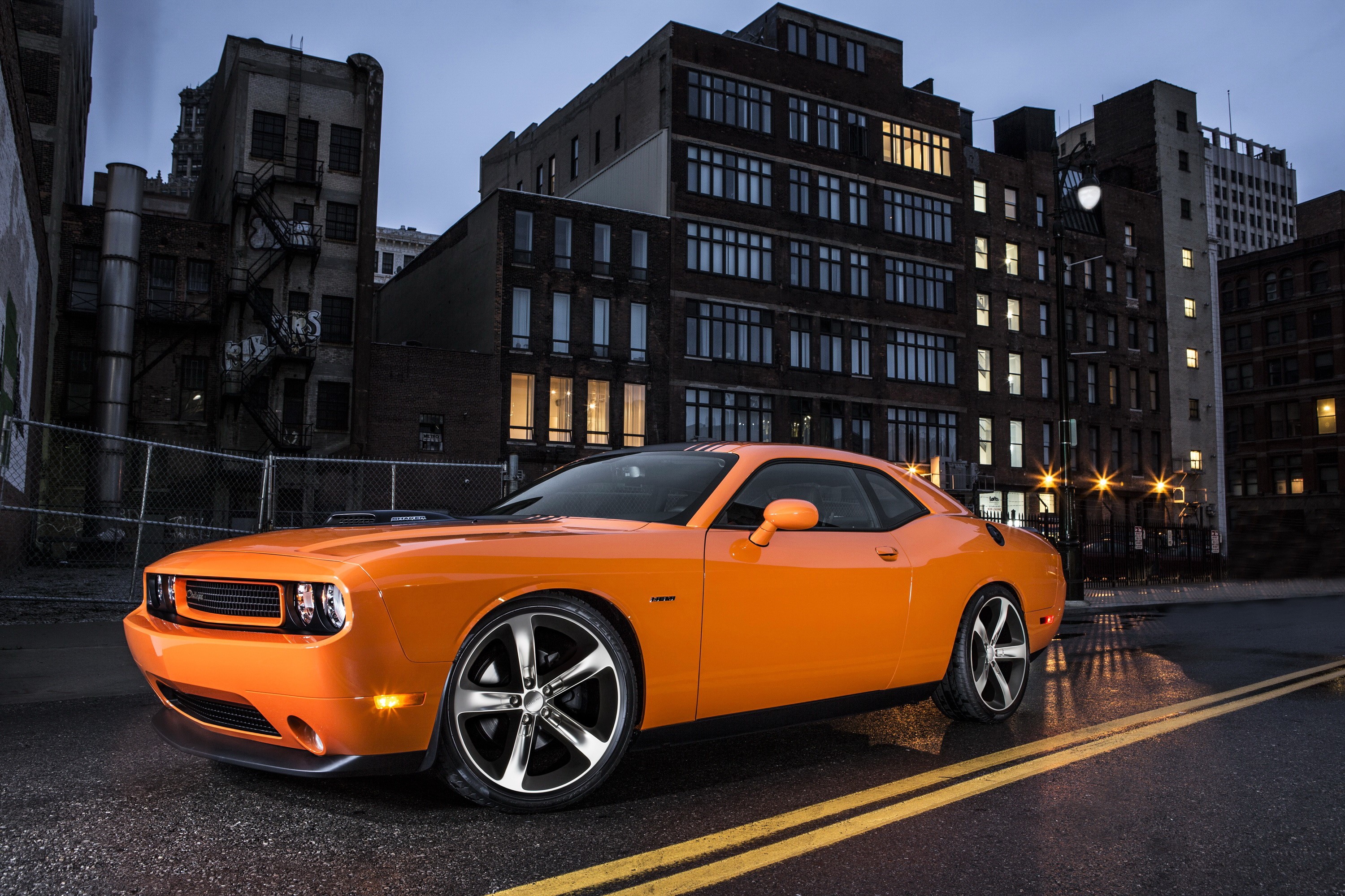 Orange Dodge Challenger HEMI Shaker parked on a wet street at night HD Wallpaper